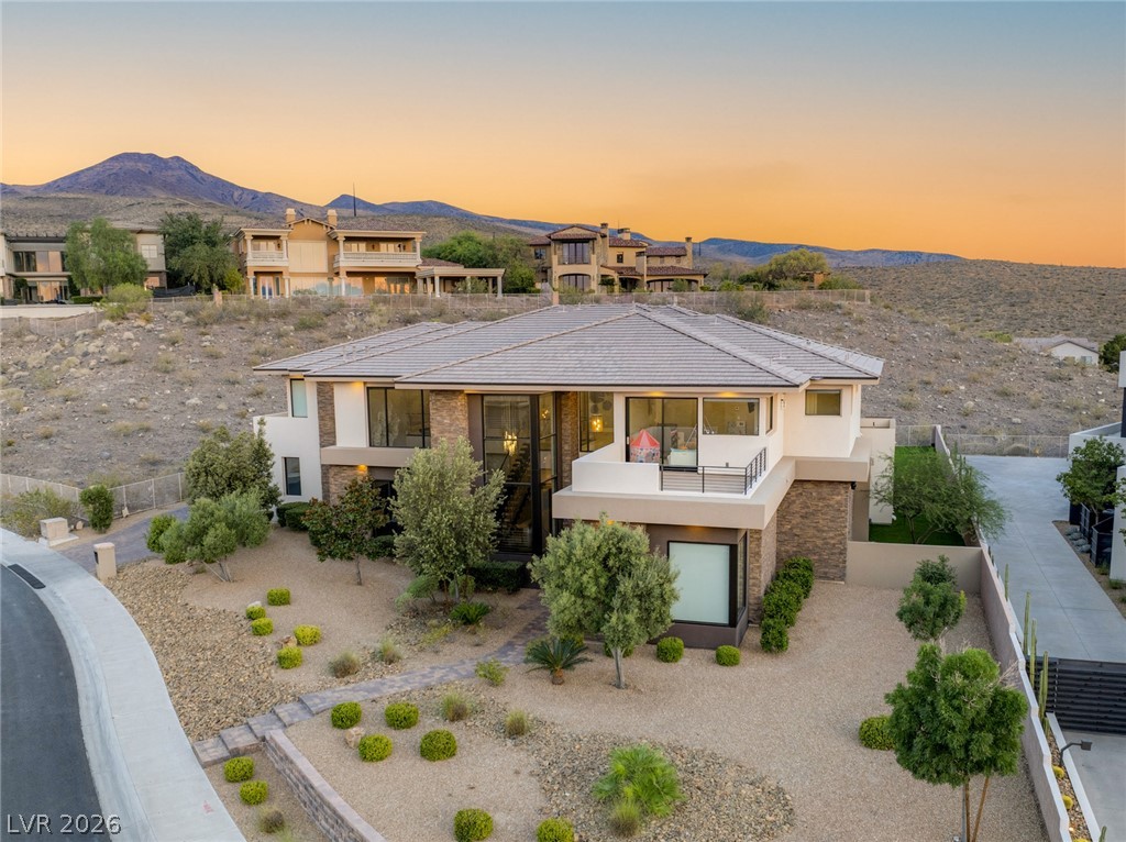 5 Crystal Tree Pass Henderson, NV 89052 - Photo 64 of 67 Perched on a gentle slope, this desert-landscaped residence commands scenic mountain views.