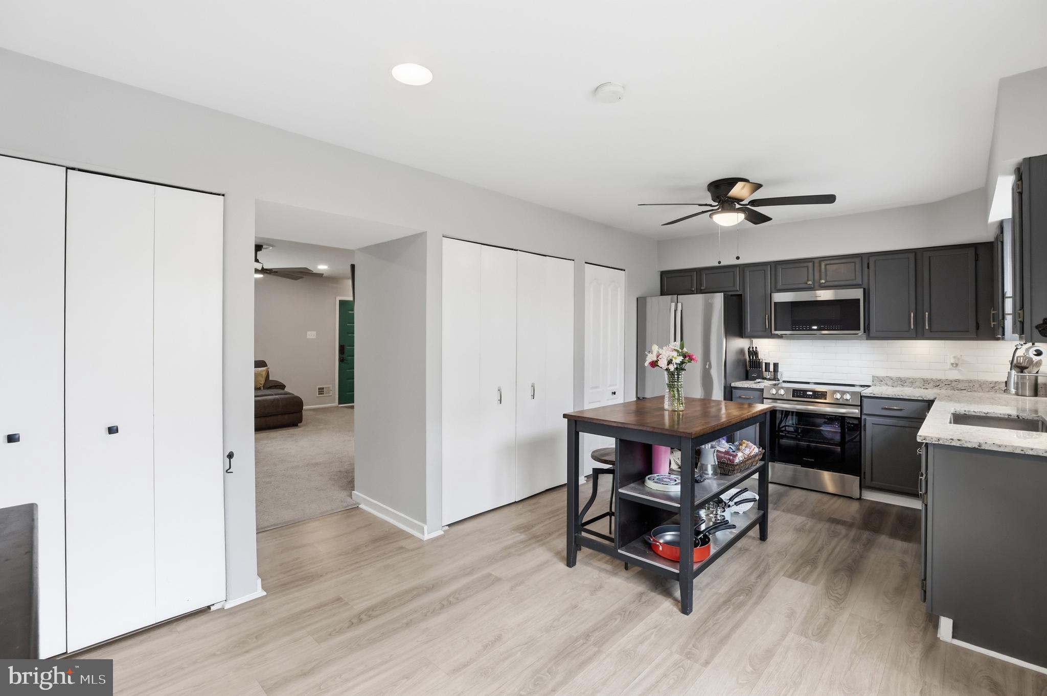 6844 Carnation Circle Frederick, MD 21703 - Photo 13 of 30 a living room with furniture and kitchen view