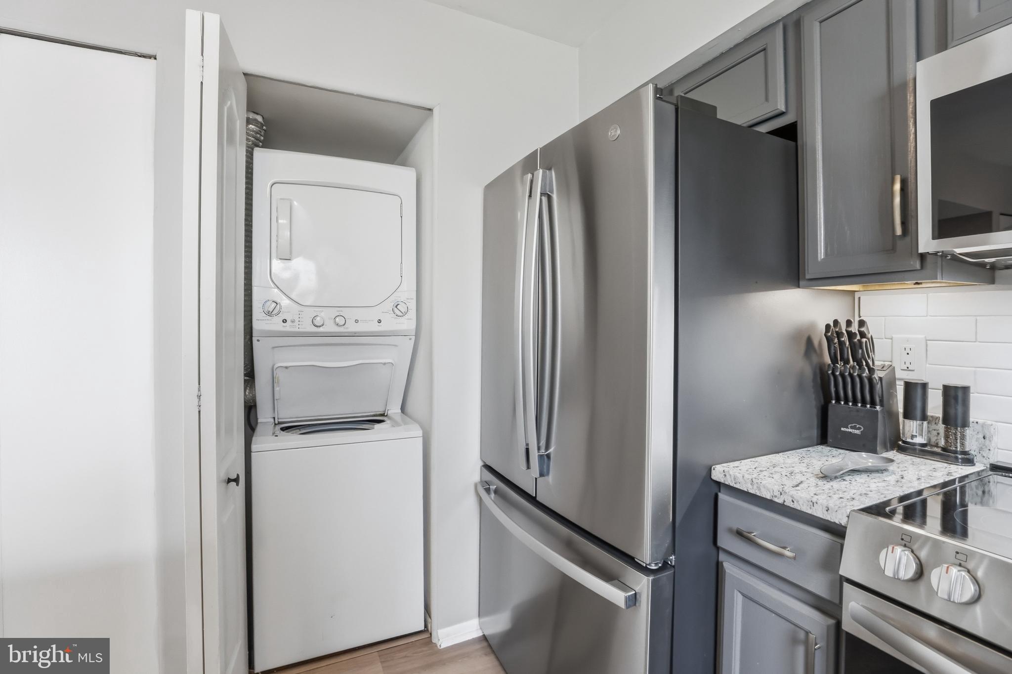 6844 Carnation Circle Frederick, MD 21703 - Photo 17 of 30 a kitchen with a refrigerator and a stove