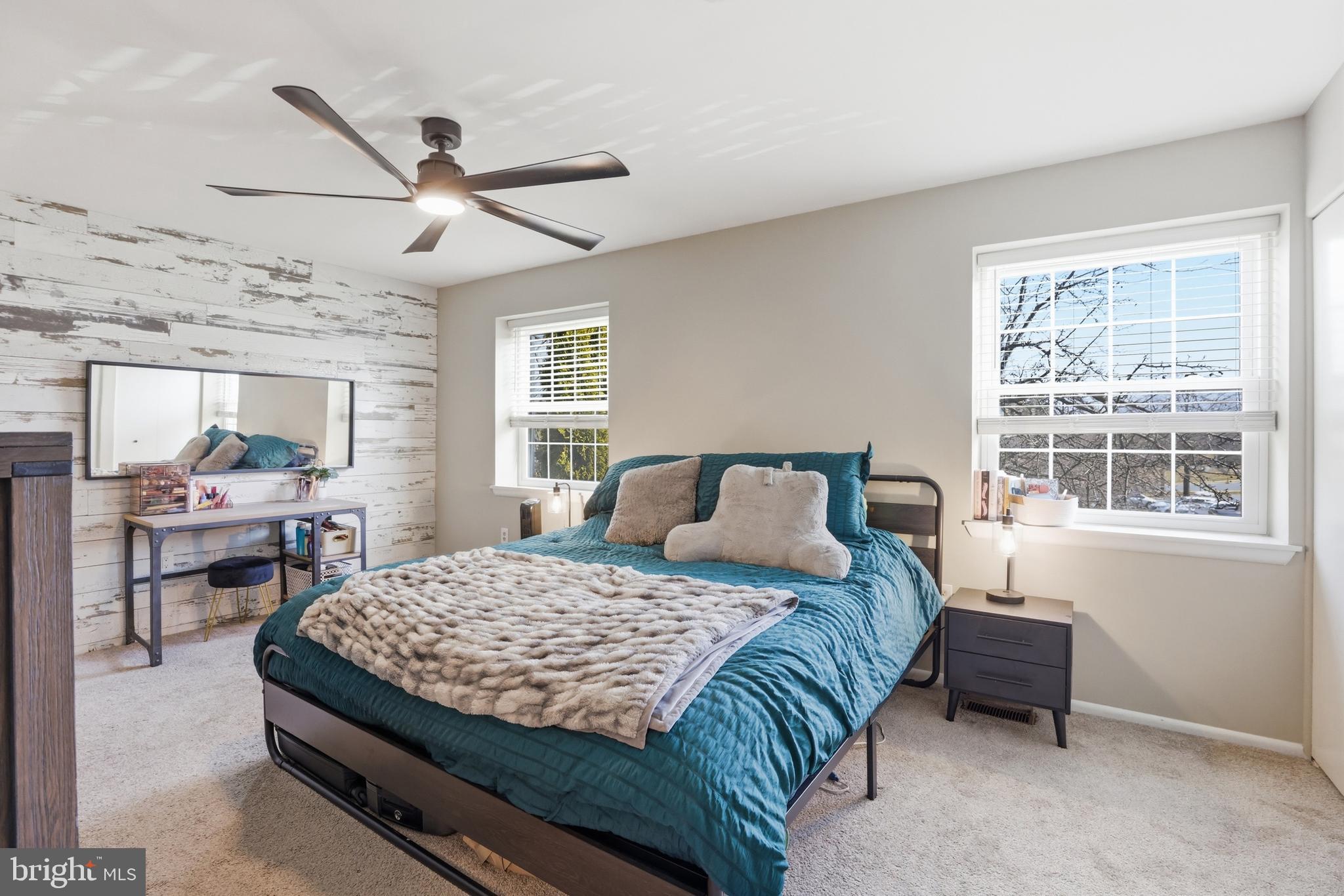 6844 Carnation Circle Frederick, MD 21703 - Photo 18 of 30 a bedroom with a bed a dresser next to a window