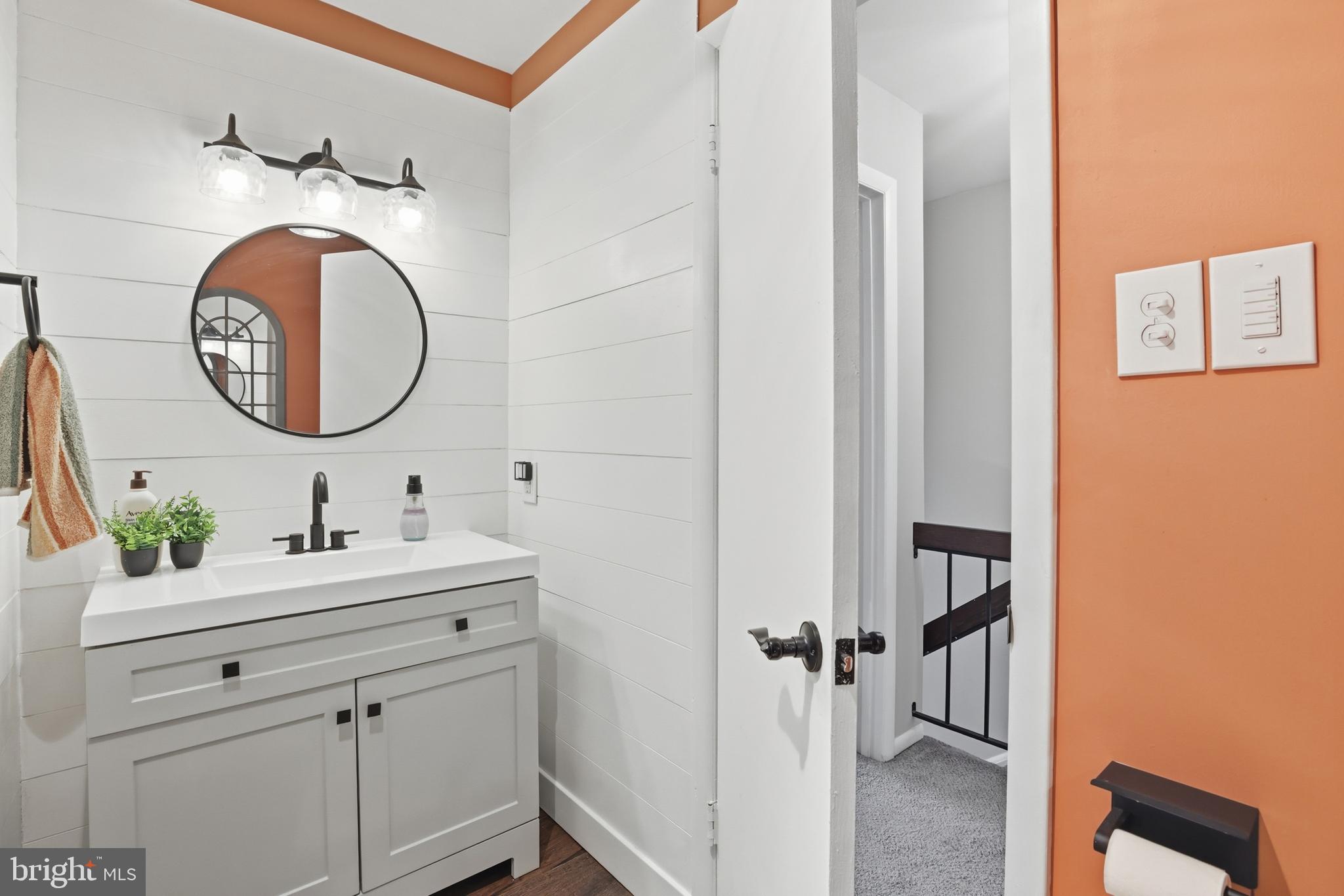 6844 Carnation Circle Frederick, MD 21703 - Photo 22 of 30 a bathroom with a sink and a mirror