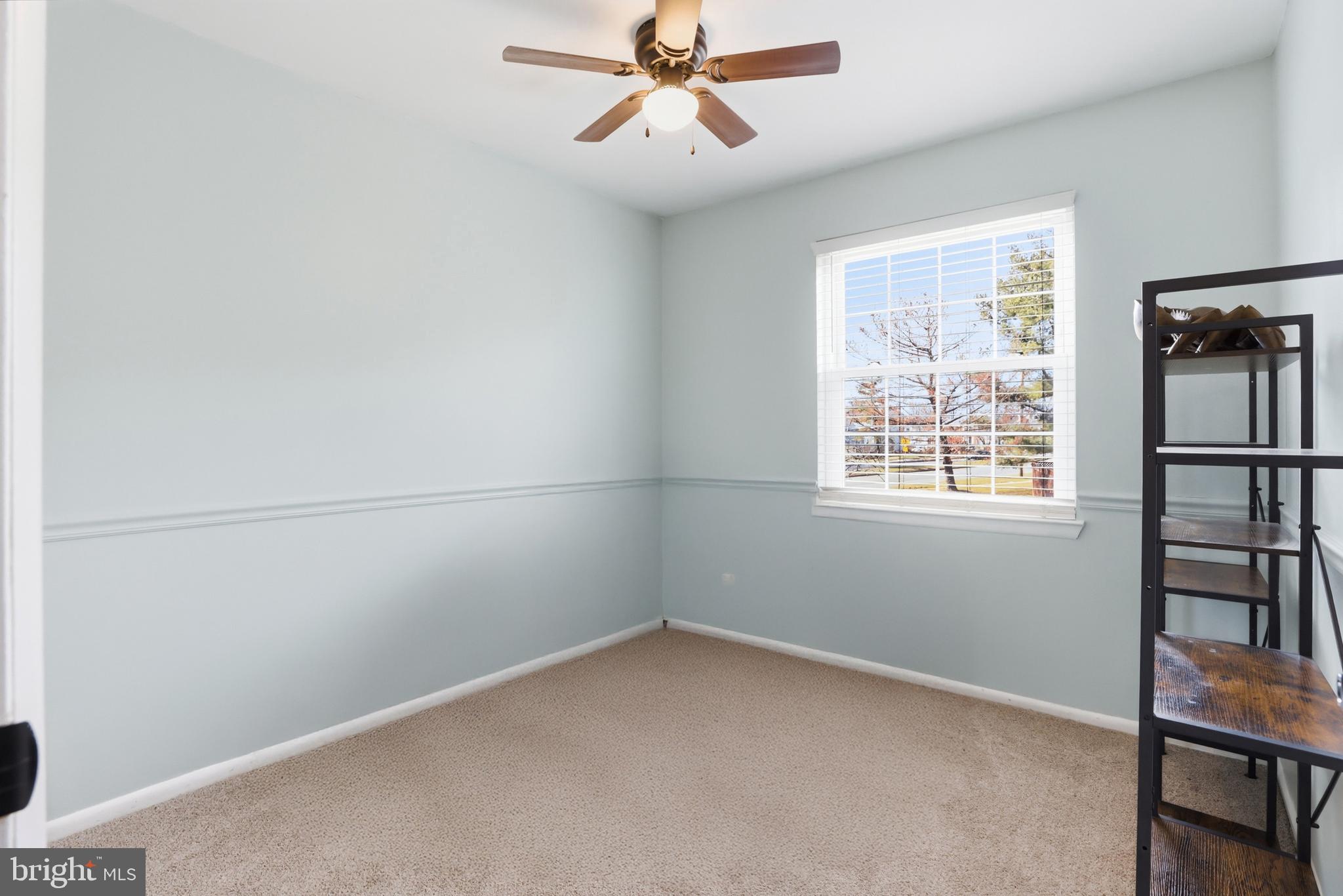 6844 Carnation Circle Frederick, MD 21703 - Photo 25 of 30 an empty room with windows and fan