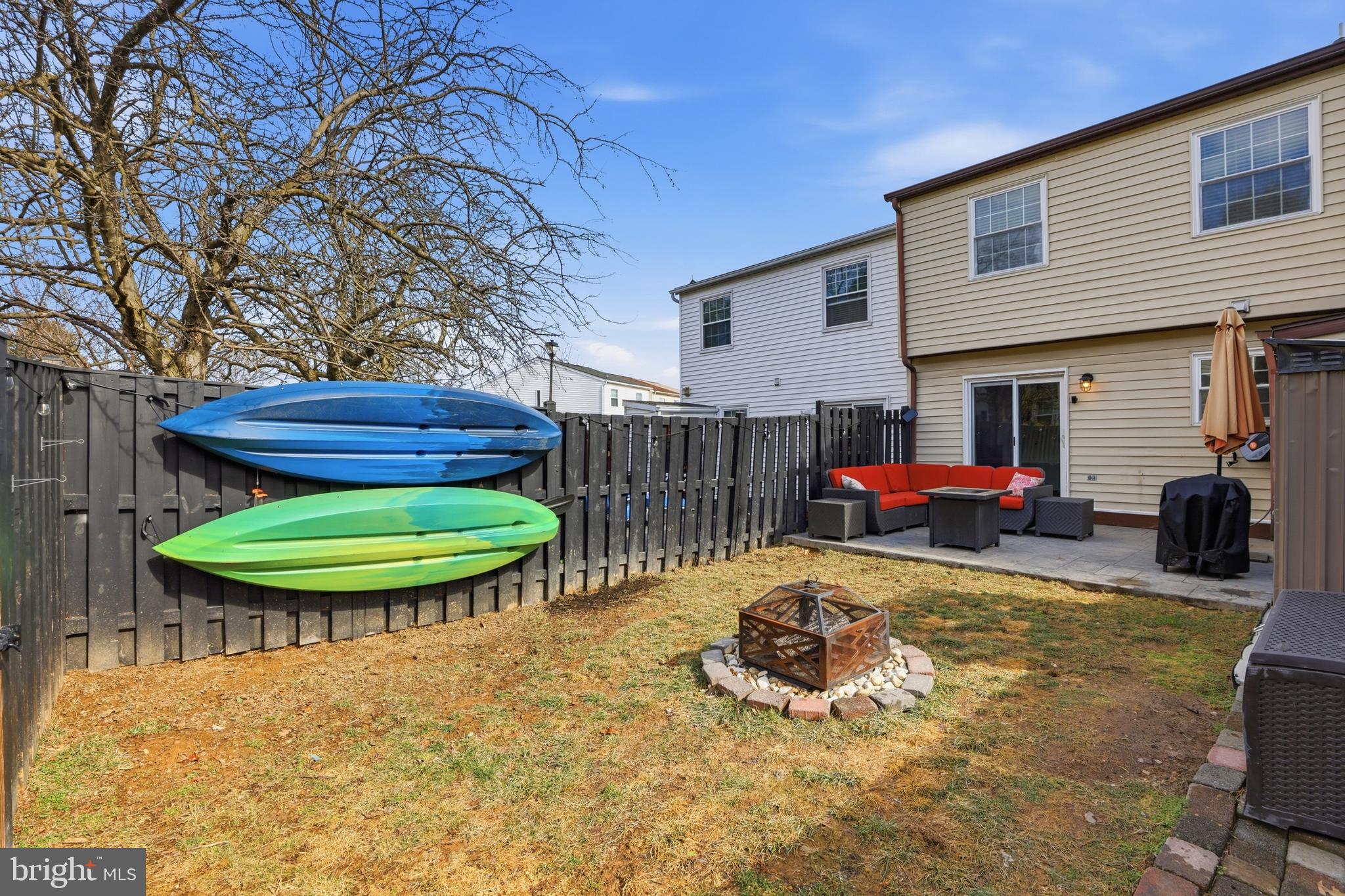 6844 Carnation Circle Frederick, MD 21703 - Photo 29 of 30 a view of a backyard with table and chairs potted plants and wooden fence