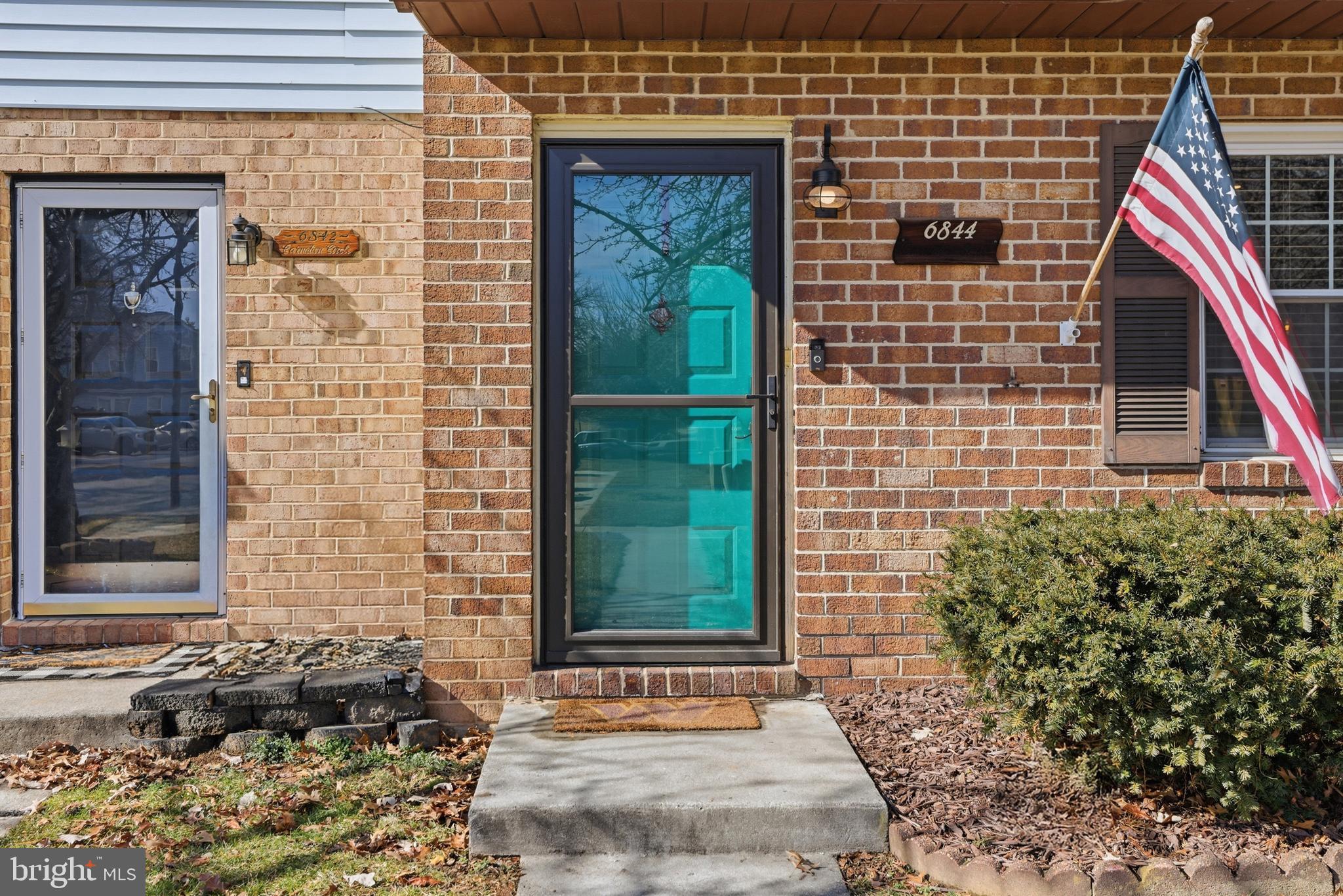 6844 Carnation Circle Frederick, MD 21703 - Photo 3 of 30 a front view of a house with a yard