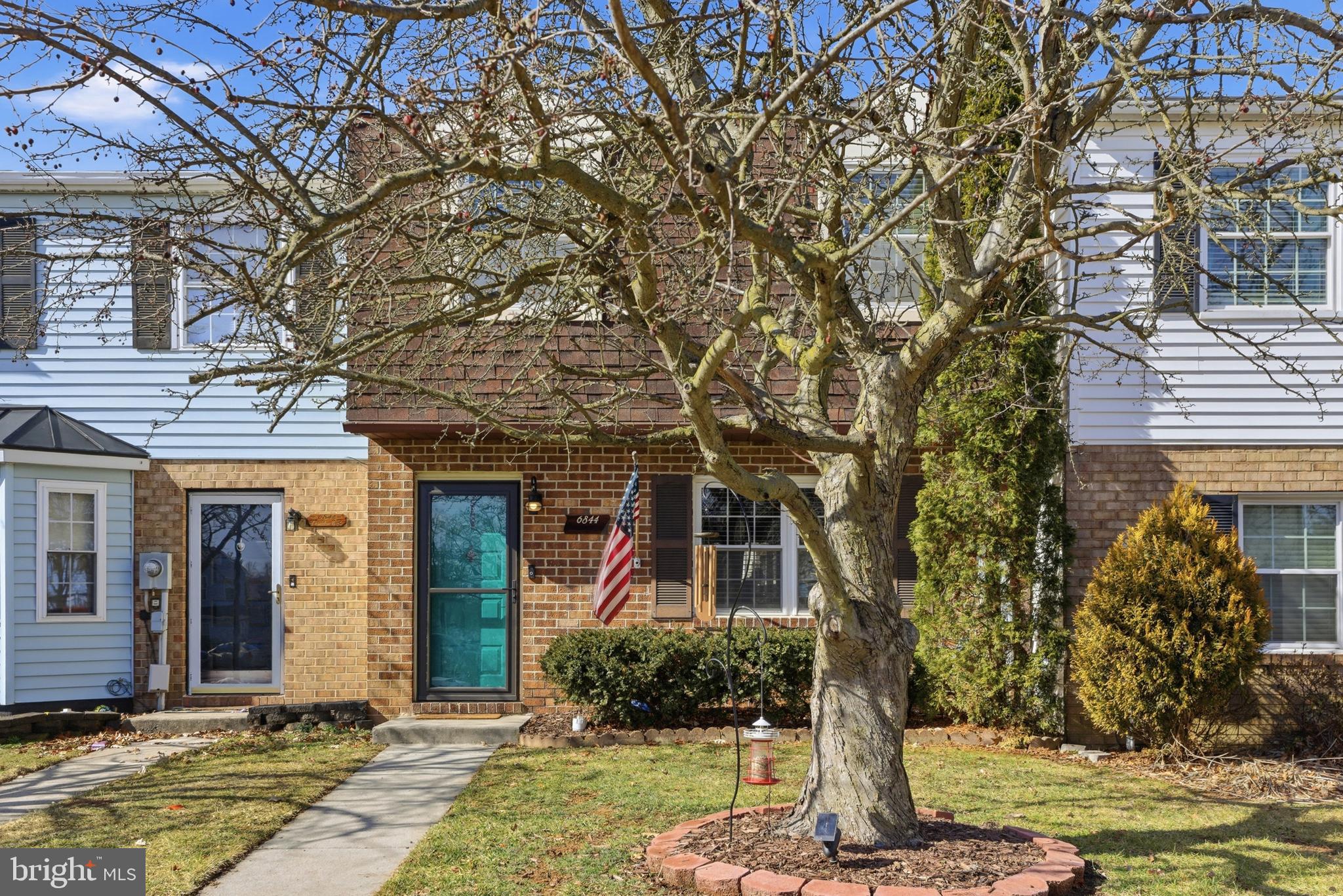 6844 Carnation Circle Frederick, MD 21703 - Photo 4 of 30 a front view of a house with a yard