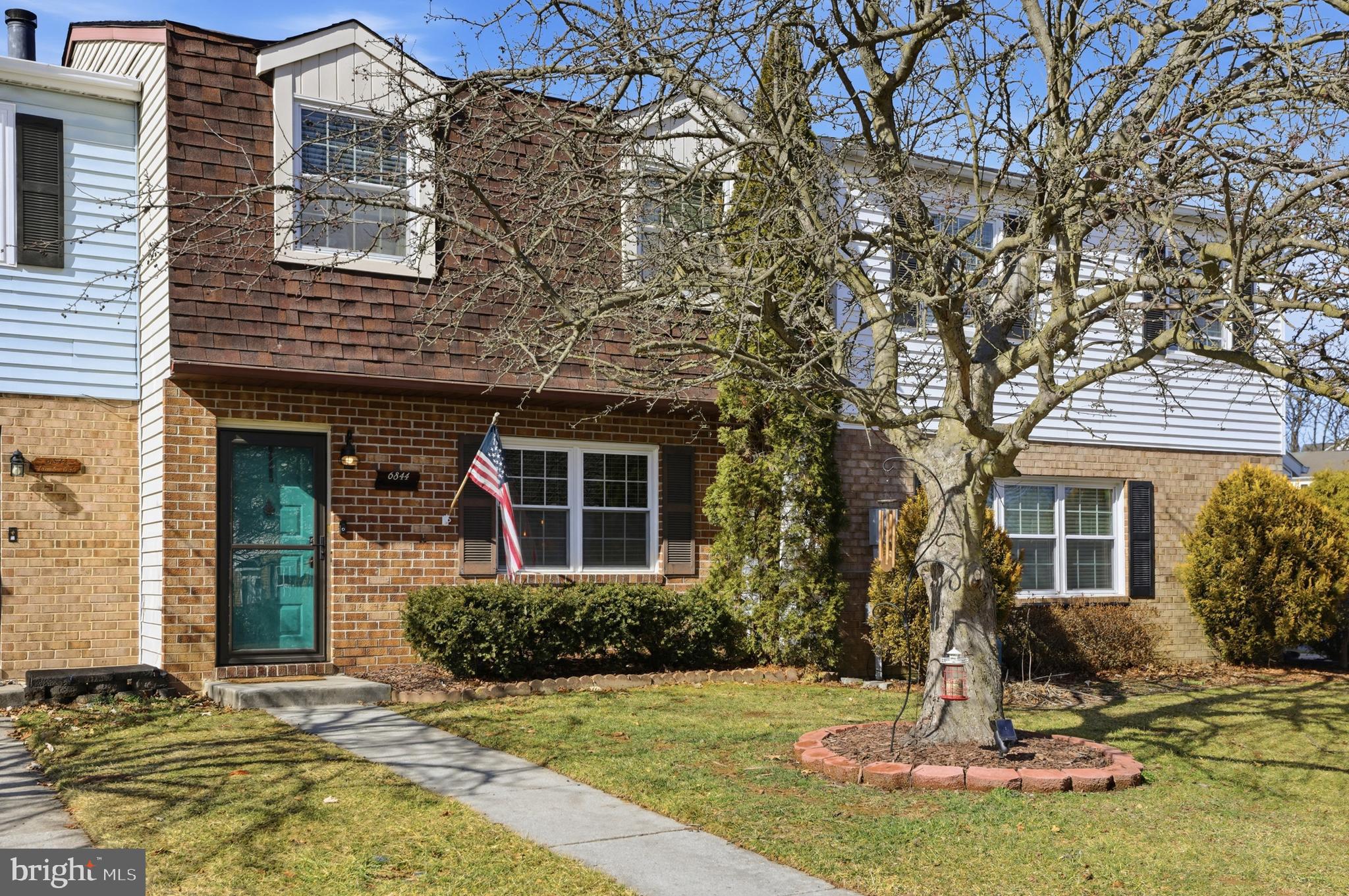 6844 Carnation Circle Frederick, MD 21703 - Photo 5 of 30 a front view of a house with a yard