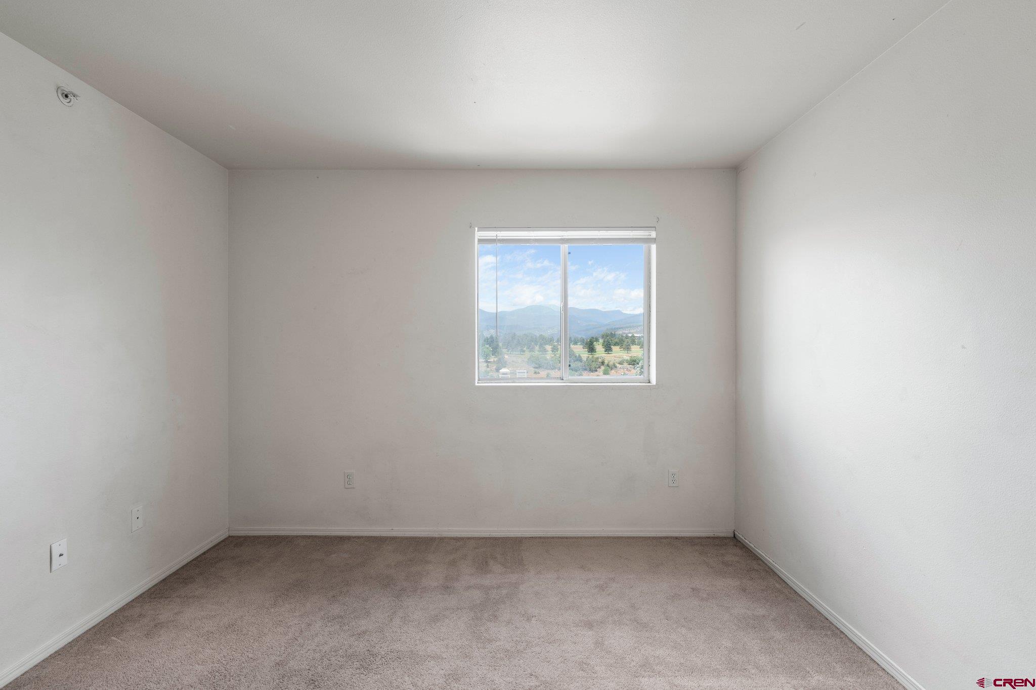 1100 Goeglein Gulch Road, Unit 247 Durango, CO 81301 - Photo 25 of 35 an empty room with a window