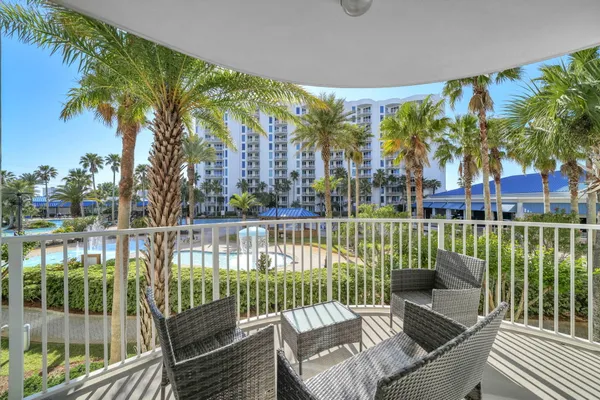 a view of a balcony with lake view and a potted plant