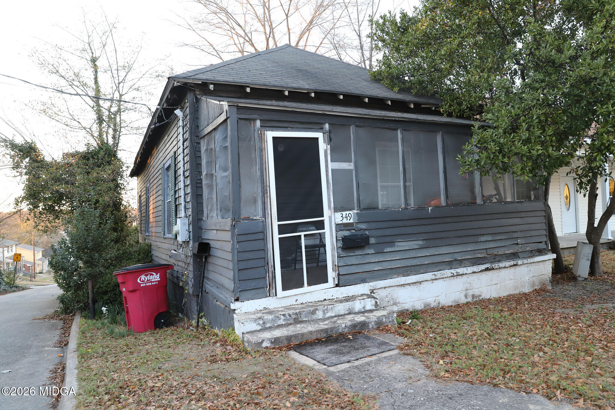 349 Madison Street Macon, GA 31201 - Photo 2 of 11 a front view of a house with parking space