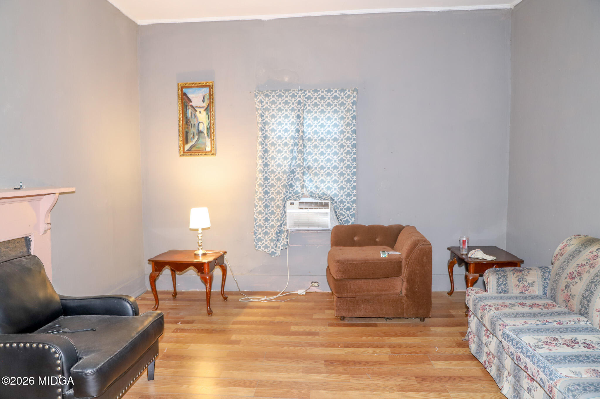 349 Madison Street Macon, GA 31201 - Photo 4 of 11 a living room with furniture and a chair