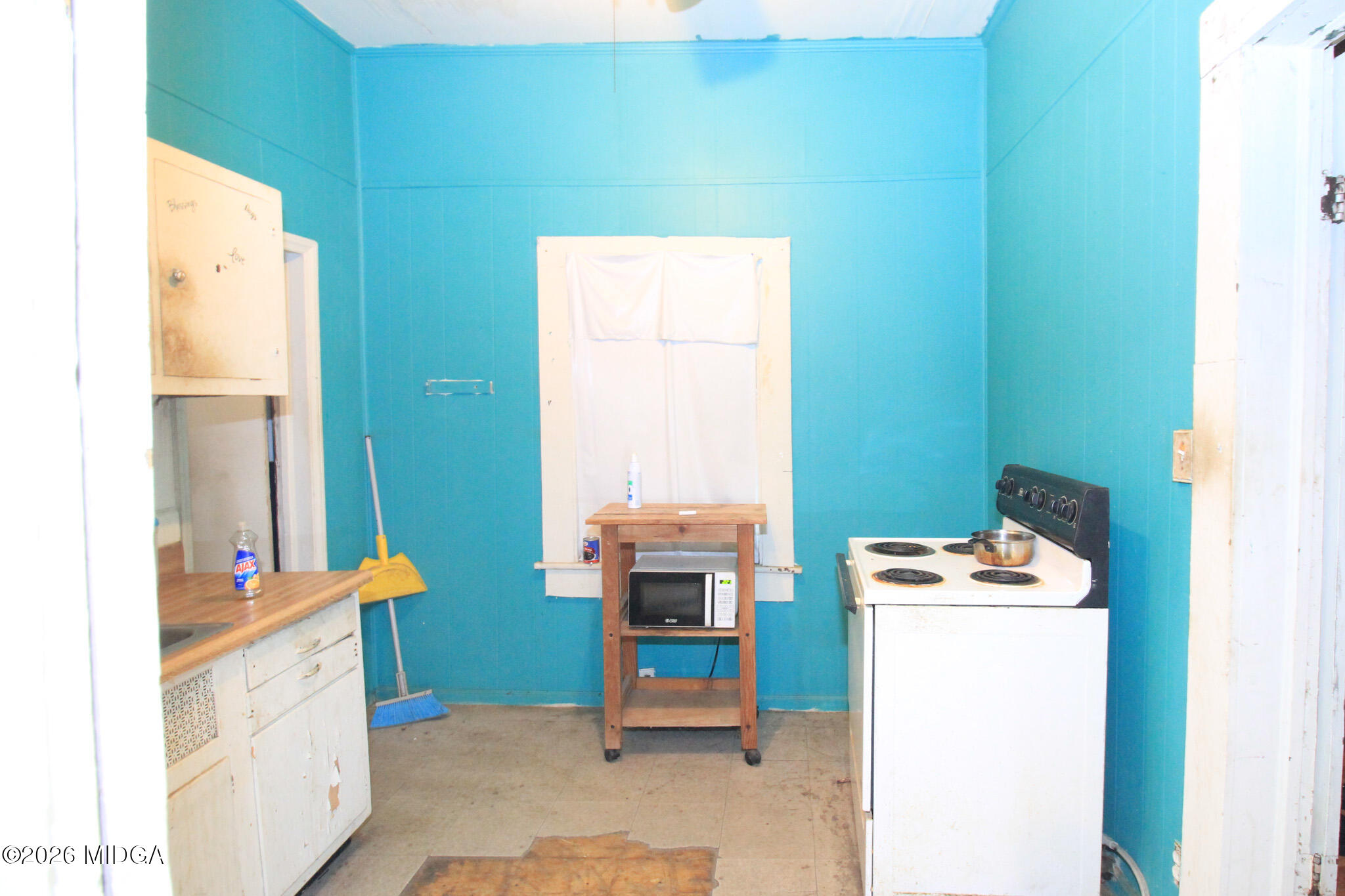 349 Madison Street Macon, GA 31201 - Photo 8 of 11 a room with storage and utility