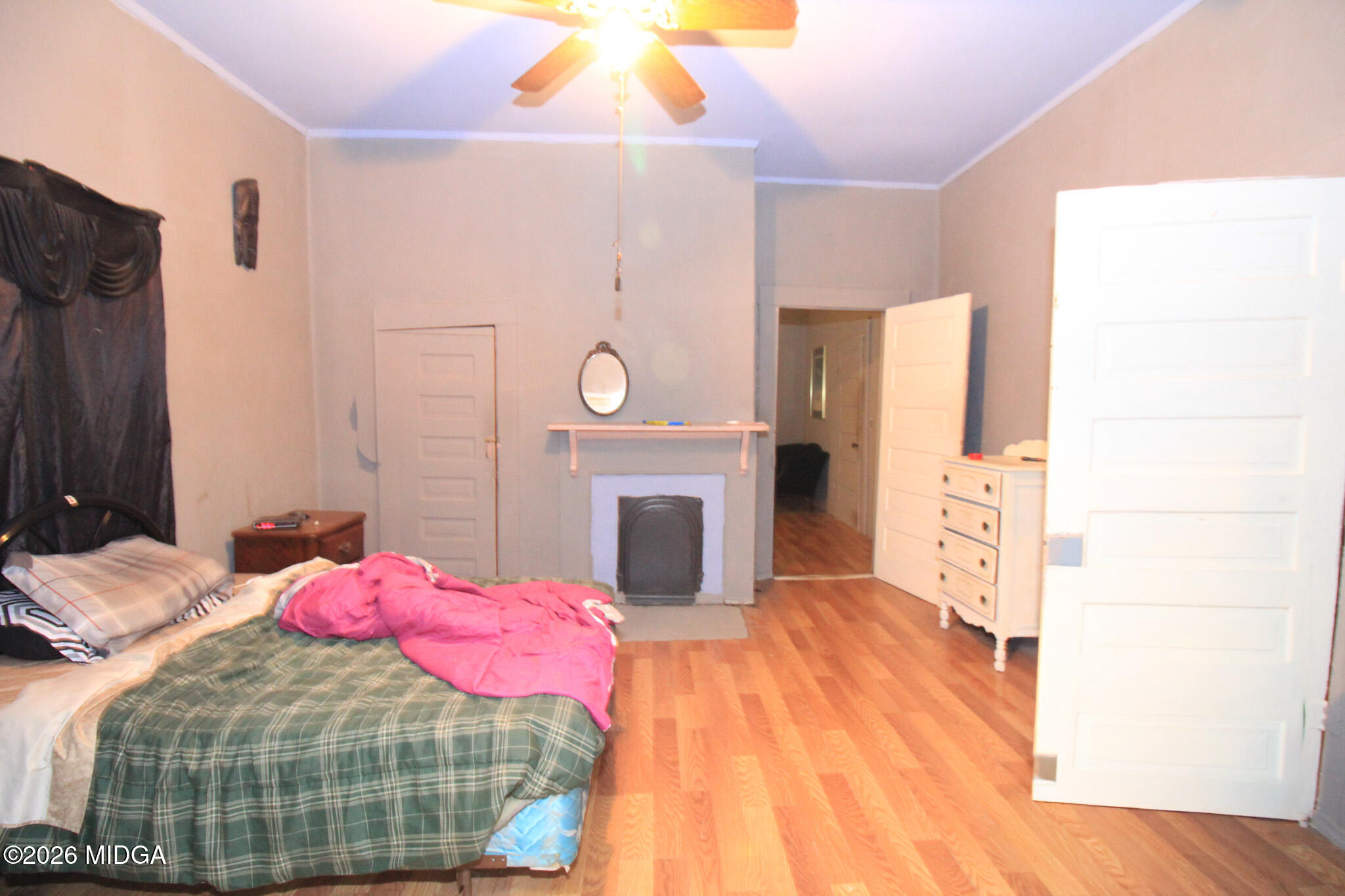 349 Madison Street Macon, GA 31201 - Photo 9 of 11 a bedroom with a bed and a fireplace