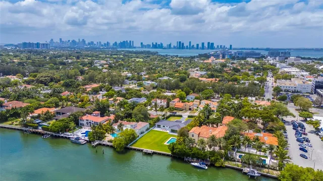 an aerial view of residential building and lake