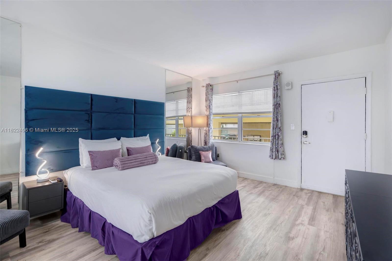 4015 Indian Creek Drive, Unit 106 Miami Beach, FL 33140 - Photo 7 of 29 a bedroom with a large bed and a window