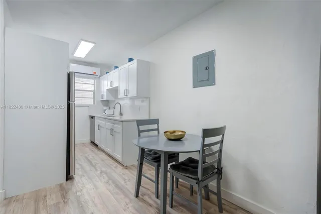 a kitchen with stainless steel appliances a refrigerator sink and cabinets