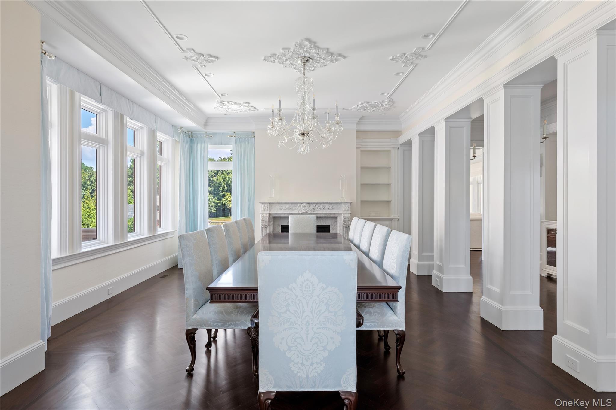 9 Hicks Lane Sands Point, NY 11050 - Photo 12 of 45 a living room with furniture a large window and wooden floor