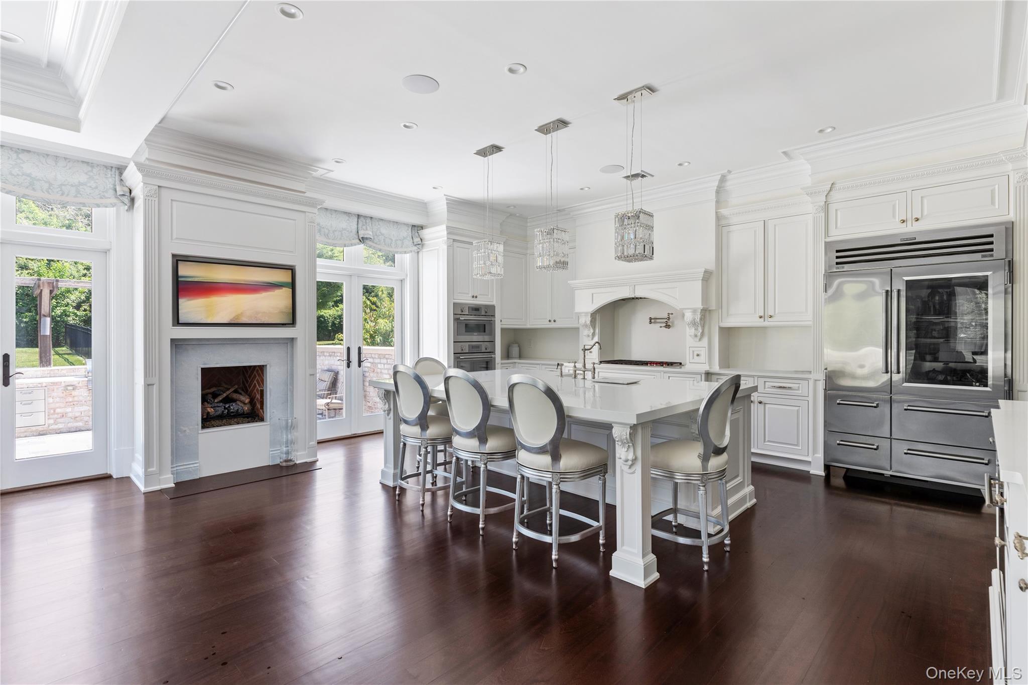 9 Hicks Lane Sands Point, NY 11050 - Photo 13 of 45 a view of a dining room with furniture wooden floor and chandelier
