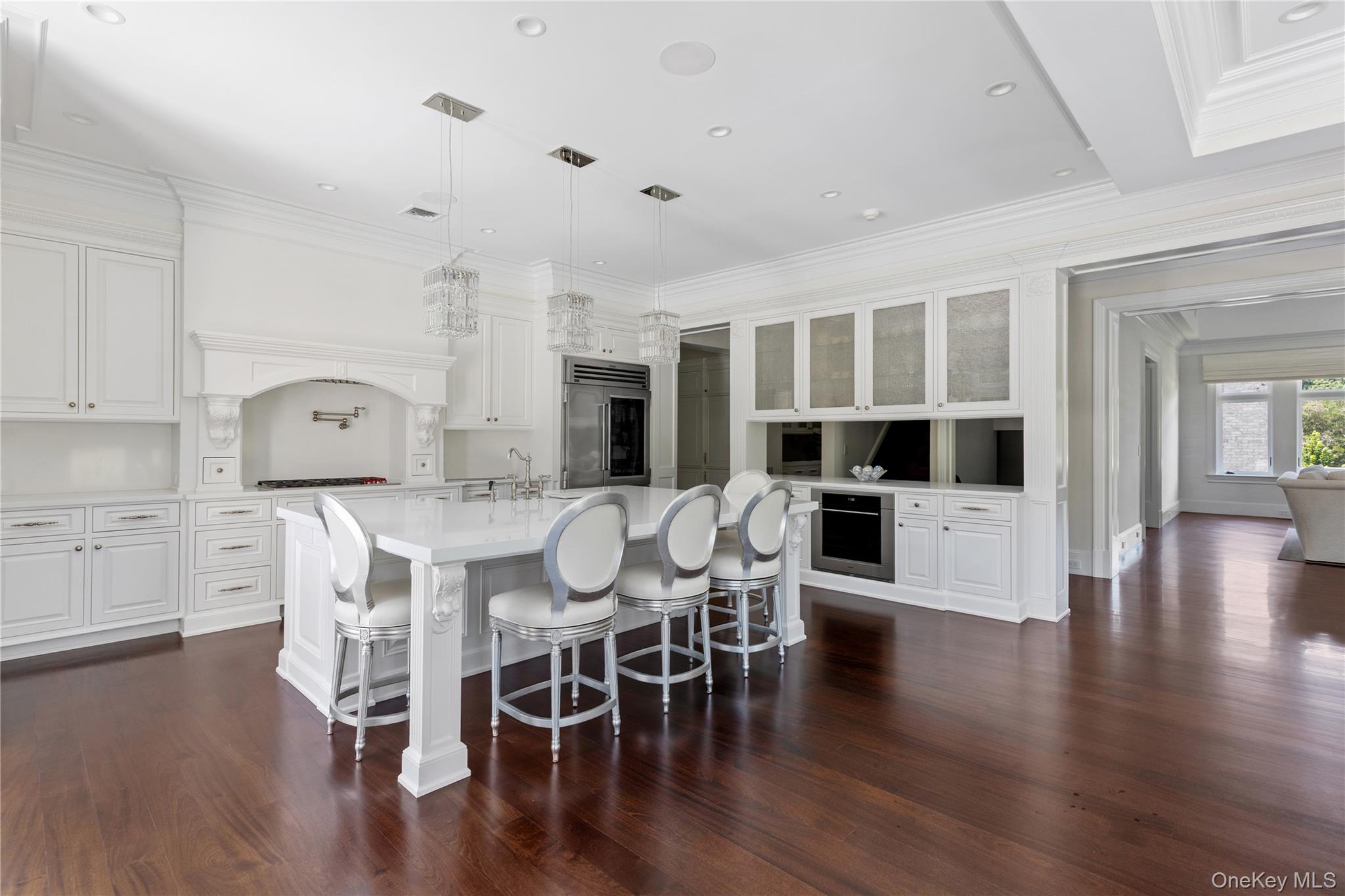 9 Hicks Lane Sands Point, NY 11050 - Photo 15 of 45 a view of a dining room with furniture and wooden floor