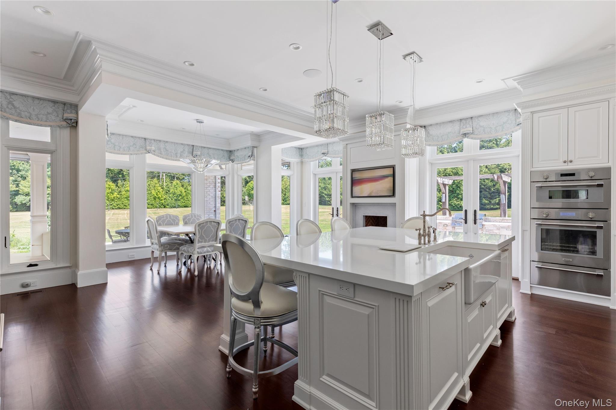 9 Hicks Lane Sands Point, NY 11050 - Photo 16 of 45 a large kitchen with a table and chairs