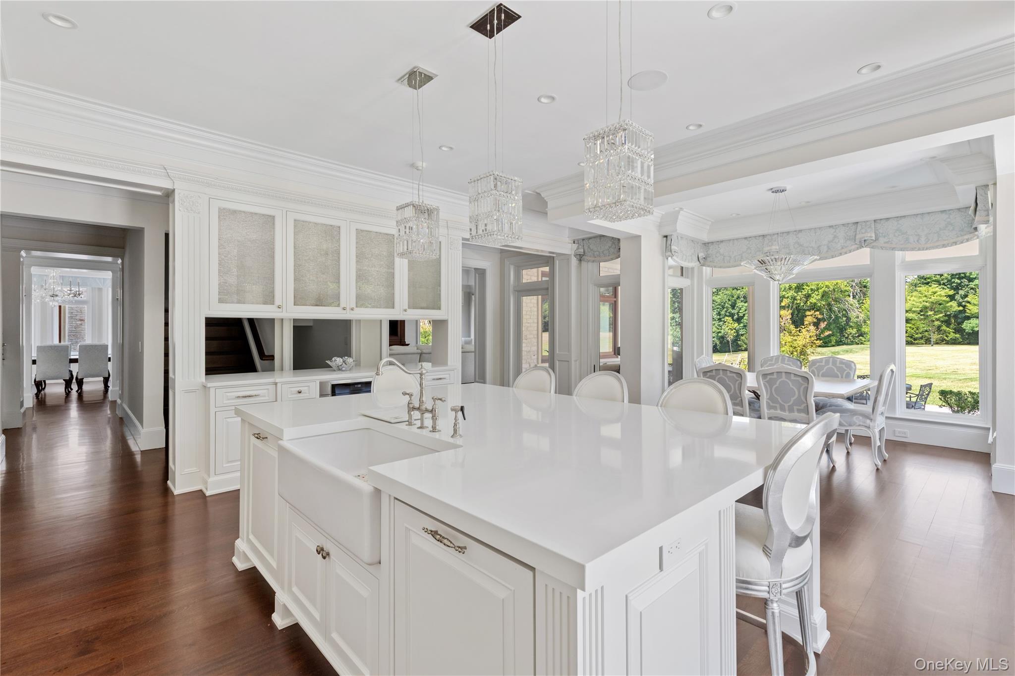 9 Hicks Lane Sands Point, NY 11050 - Photo 17 of 45 a large white kitchen with a large window