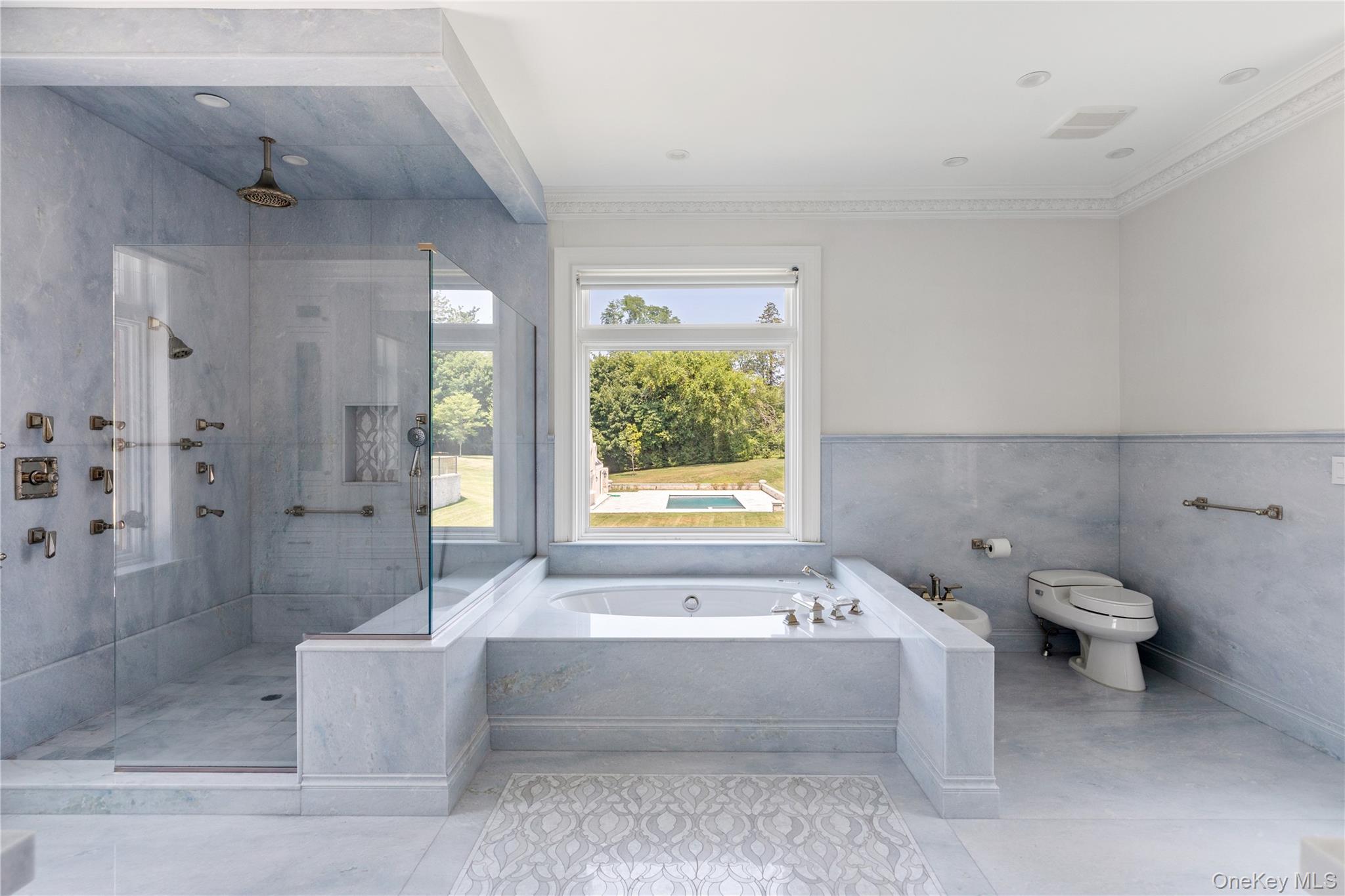 9 Hicks Lane Sands Point, NY 11050 - Photo 25 of 45 a bathroom with a bathtub and shower