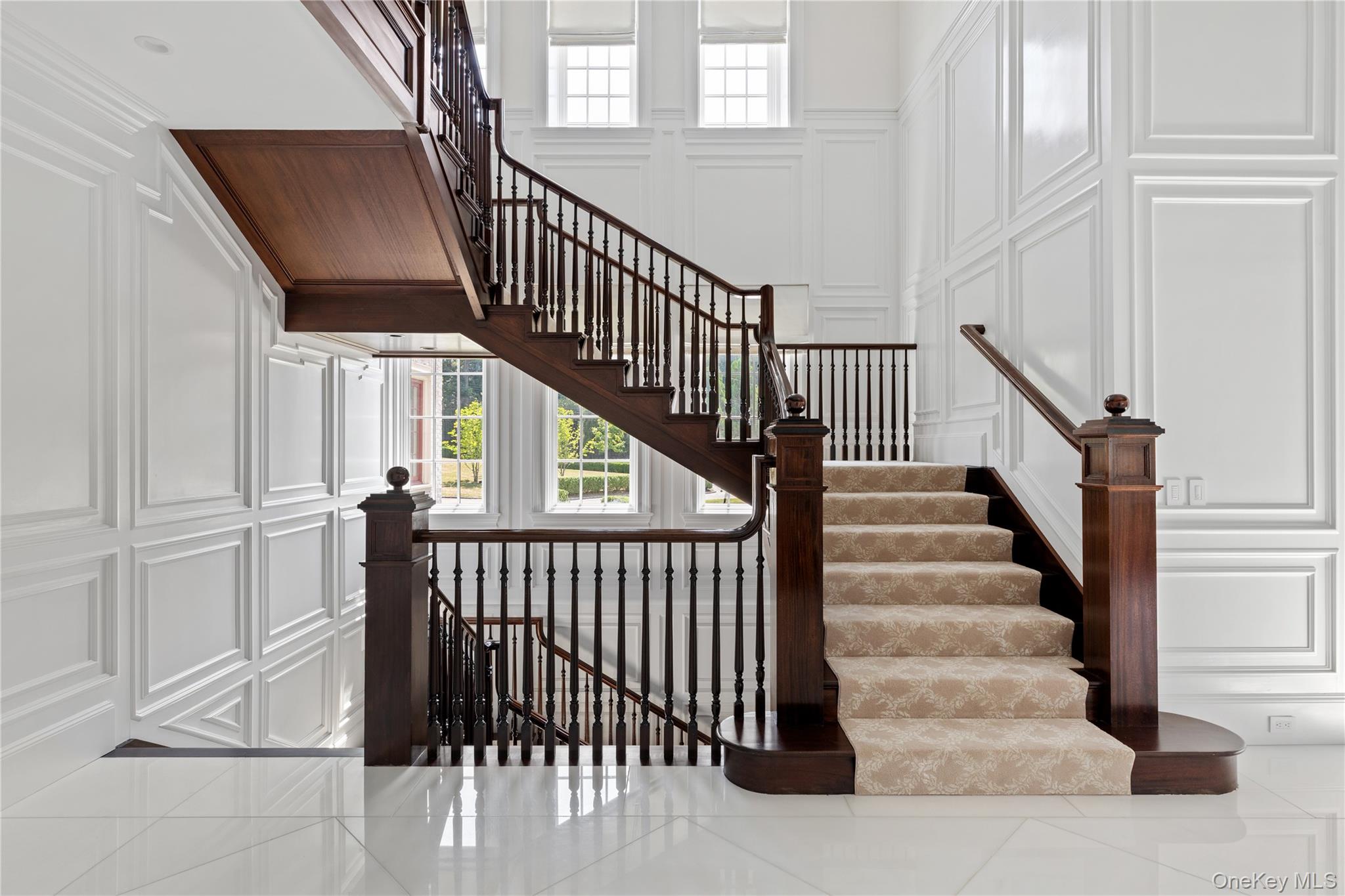 9 Hicks Lane Sands Point, NY 11050 - Photo 27 of 45 a view of entryway with wooden floor and stairs