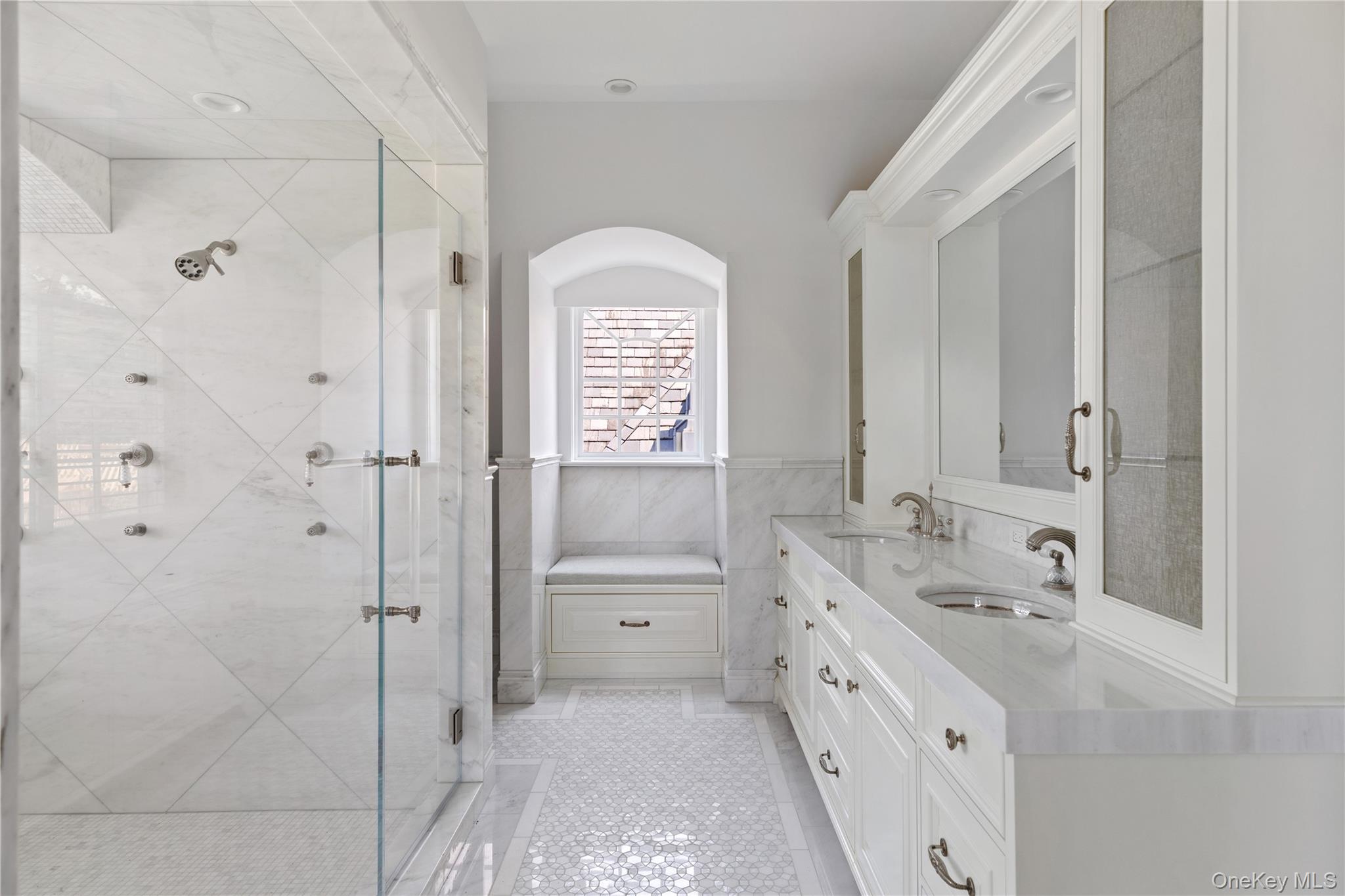 9 Hicks Lane Sands Point, NY 11050 - Photo 30 of 45 a spacious bathroom with a double vanity sink a mirror and a shower