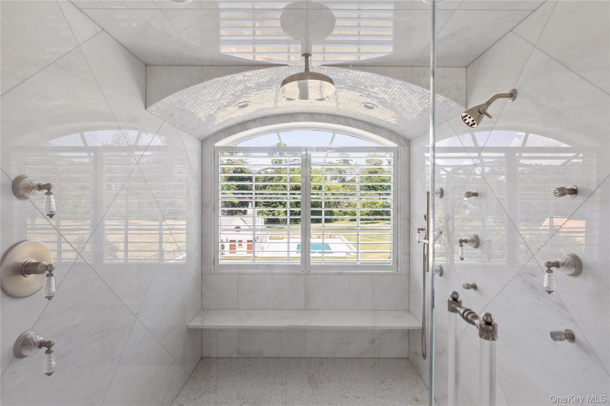 9 Hicks Lane Sands Point, NY 11050 - Photo 31 of 45 a spacious bathroom with a window a sink and shower