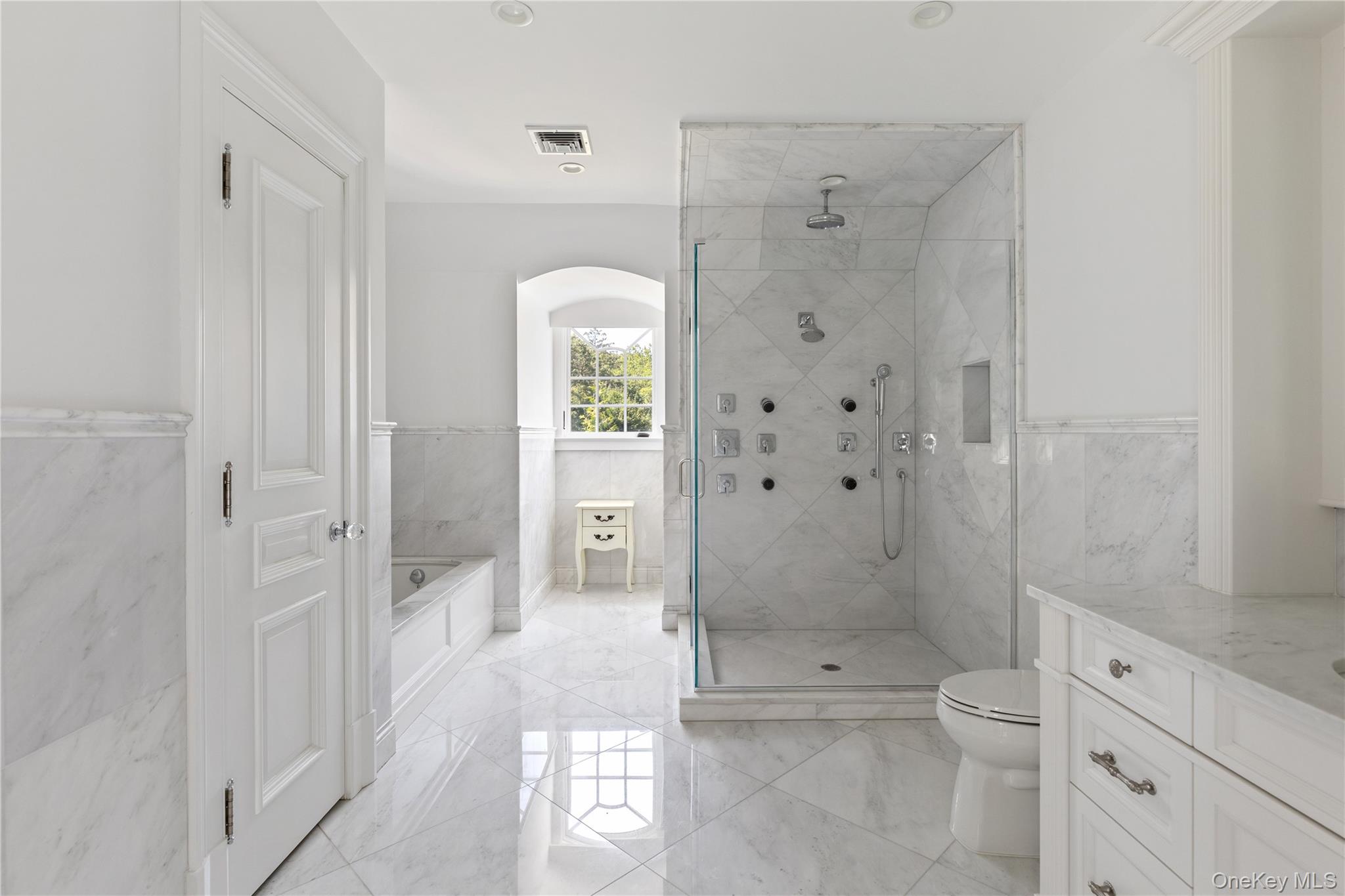 9 Hicks Lane Sands Point, NY 11050 - Photo 34 of 45 a bathroom with a shower toilet and sink