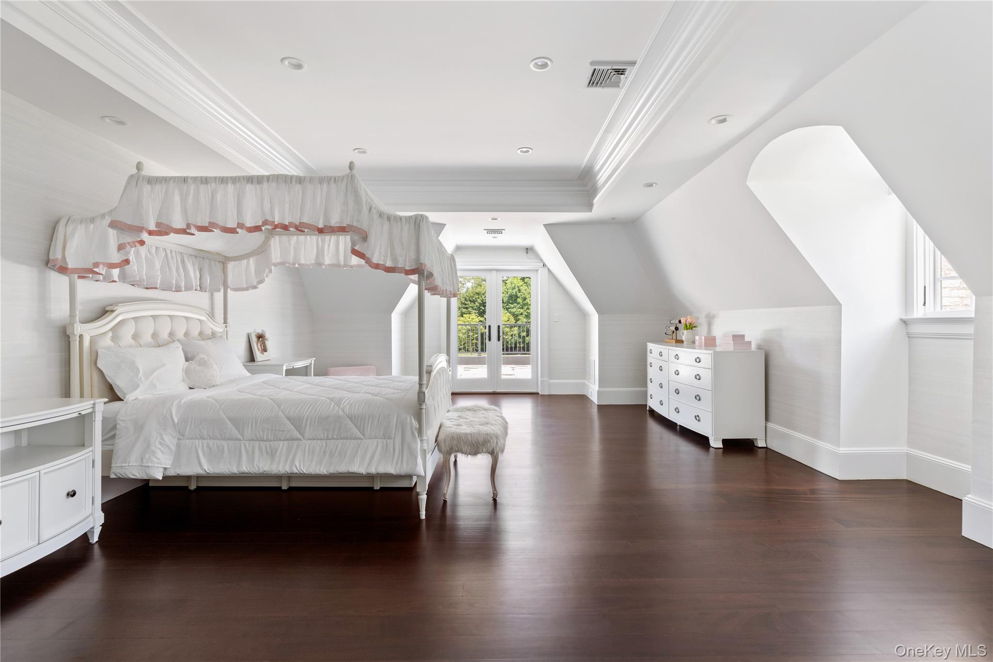 9 Hicks Lane Sands Point, NY 11050 - Photo 35 of 45 a spacious bedroom with a bed and a large window