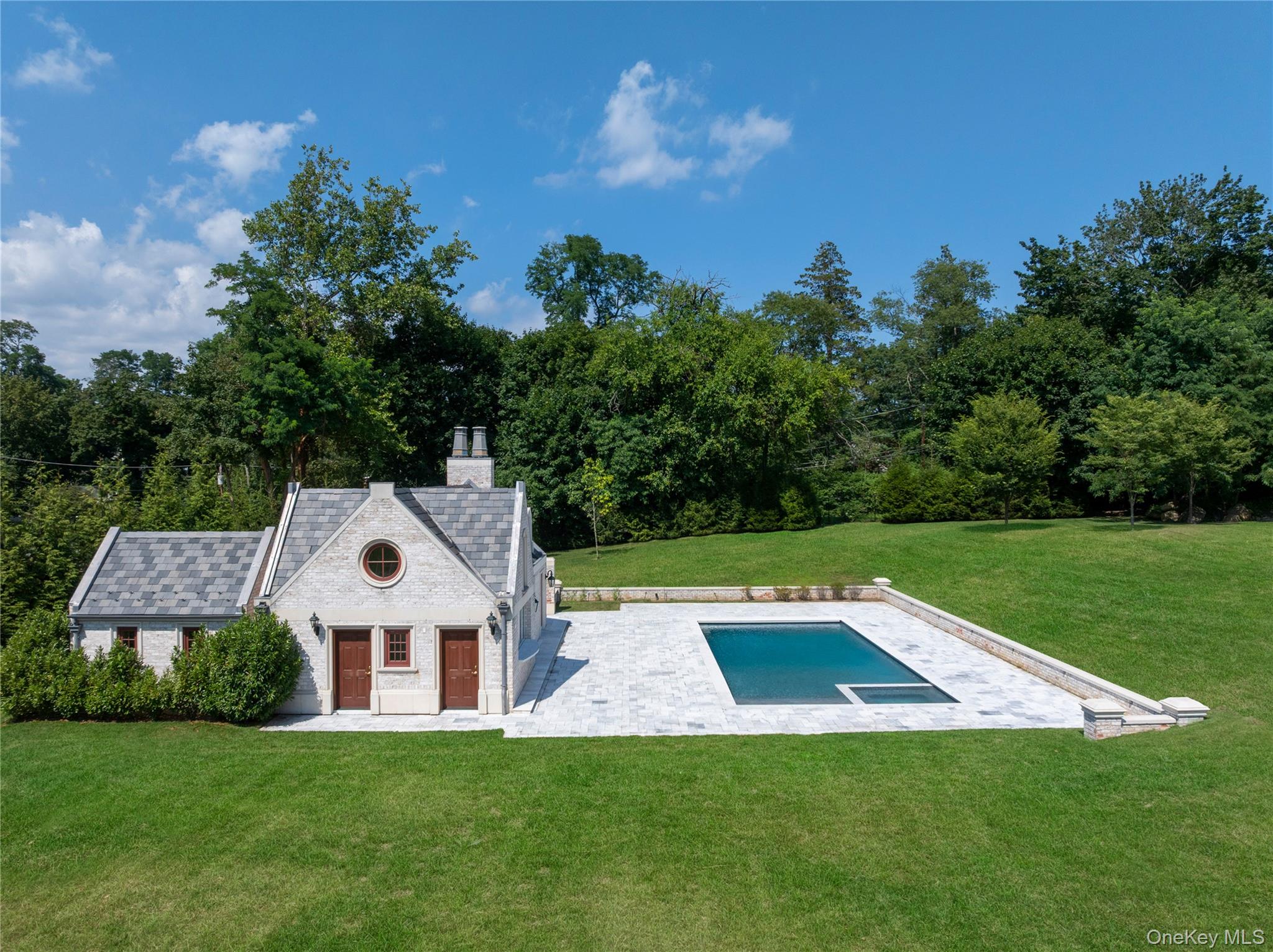 9 Hicks Lane Sands Point, NY 11050 - Photo 7 of 45 a view of a house with a yard