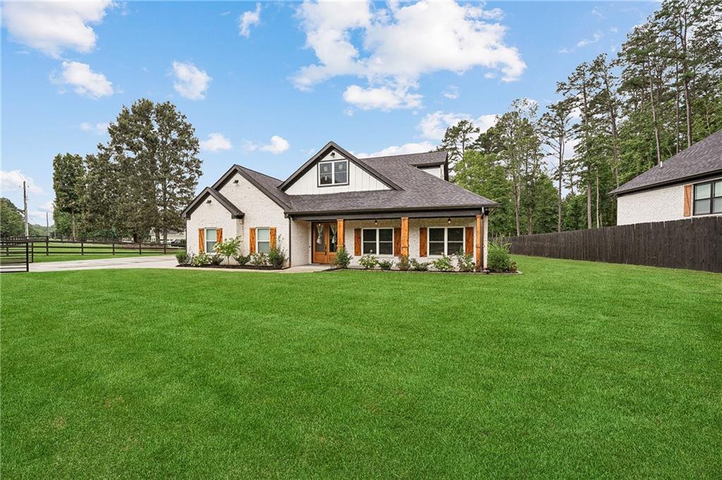 a front view of a house with a yard