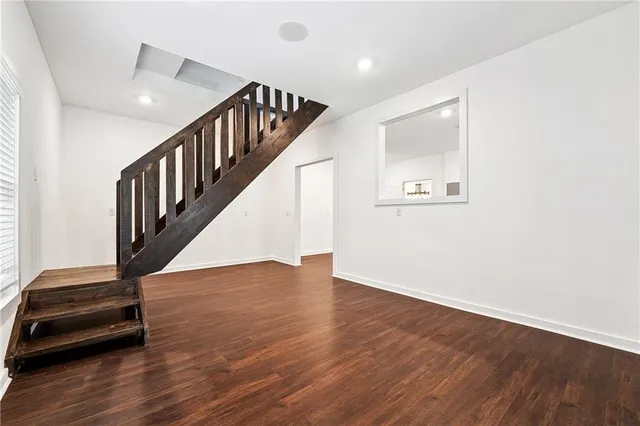 a view of an entryway with wooden floor