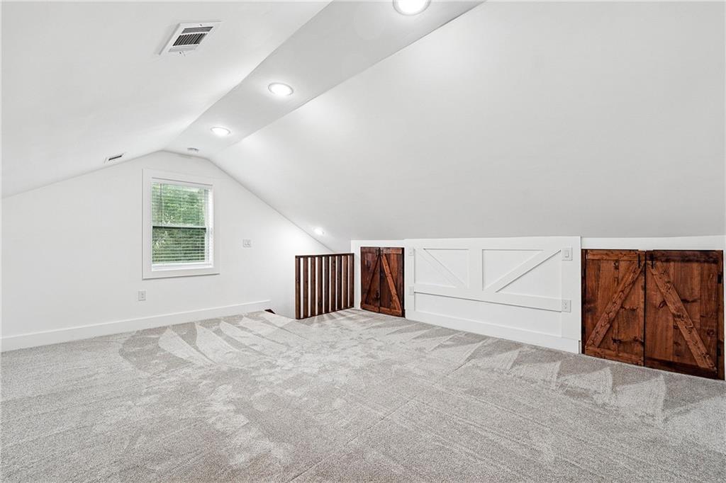 4603 Clarks Bridge Road Gainesville, GA 30506 - Photo 27 of 40 an empty room with windows
