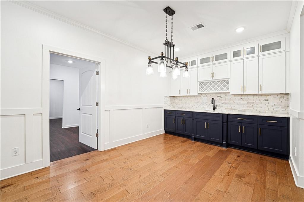 4603 Clarks Bridge Road Gainesville, GA 30506 - Photo 10 of 40 a kitchen with a refrigerator and chandelier