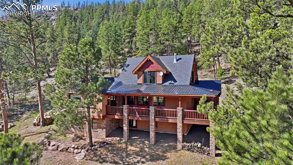 89 Ranch View Road Florissant, CO 80816 - Photo 3 of 50 Windows facing every direction perfectly capture the scenic landscape from every room.
