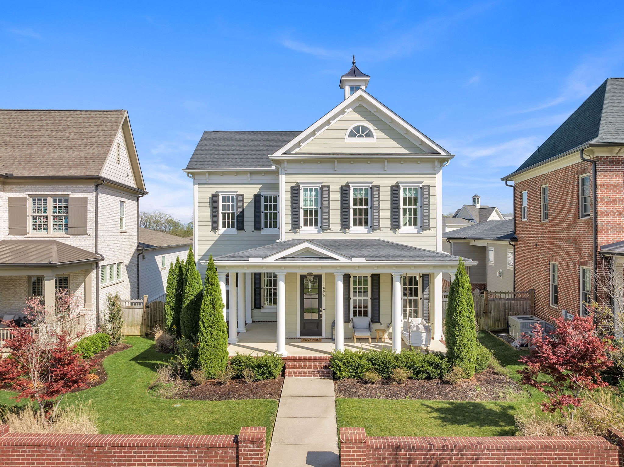 a front view of a house with a yard