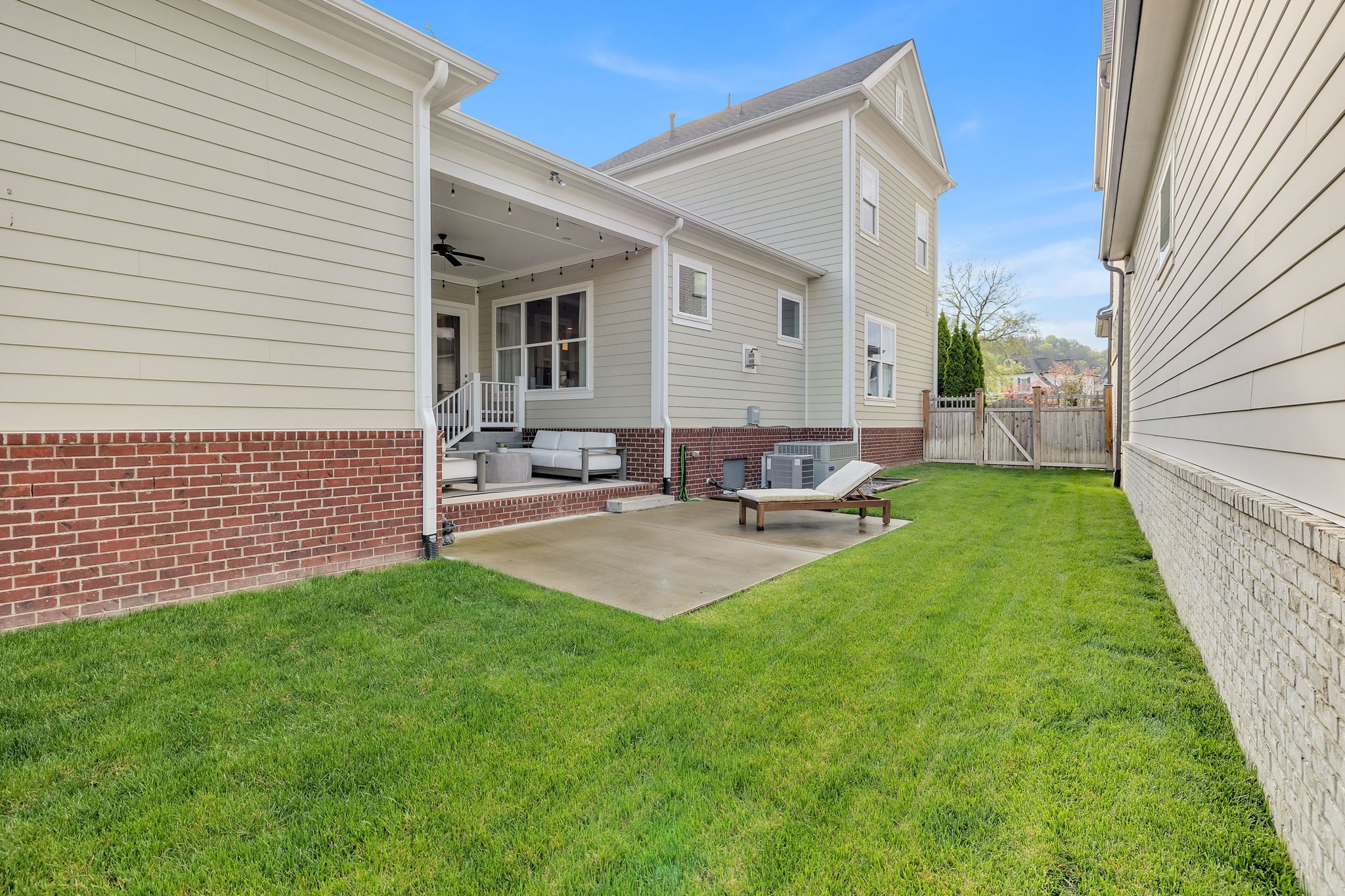 1606 Eliot Road Franklin, TN 37064 - Photo 36 of 49 a backyard of a house with table and chairs