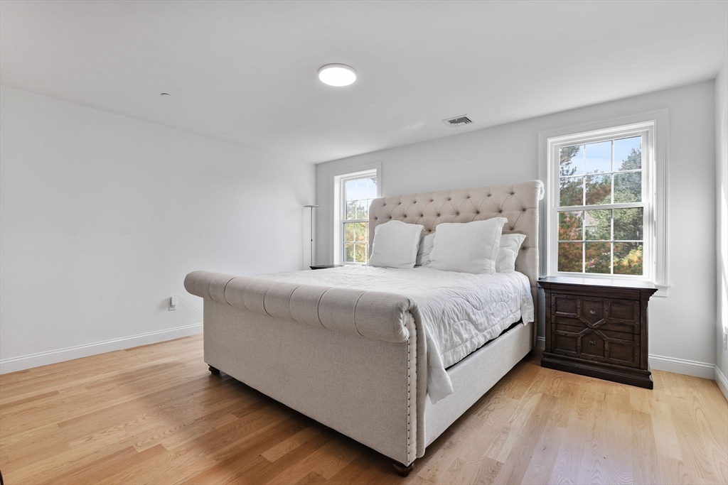 68 Prospect Street, Unit 14 Peabody, MA 01960 - Photo 11 of 29 a bedroom with a bed and window