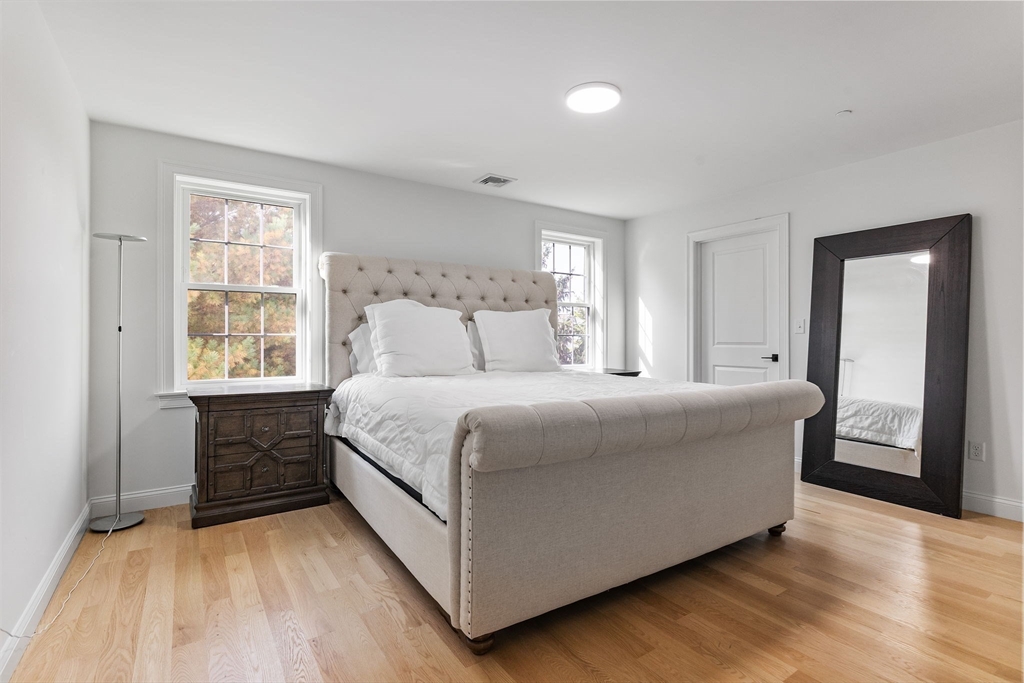 68 Prospect Street, Unit 14 Peabody, MA 01960 - Photo 12 of 29 a bedroom with a bed and window