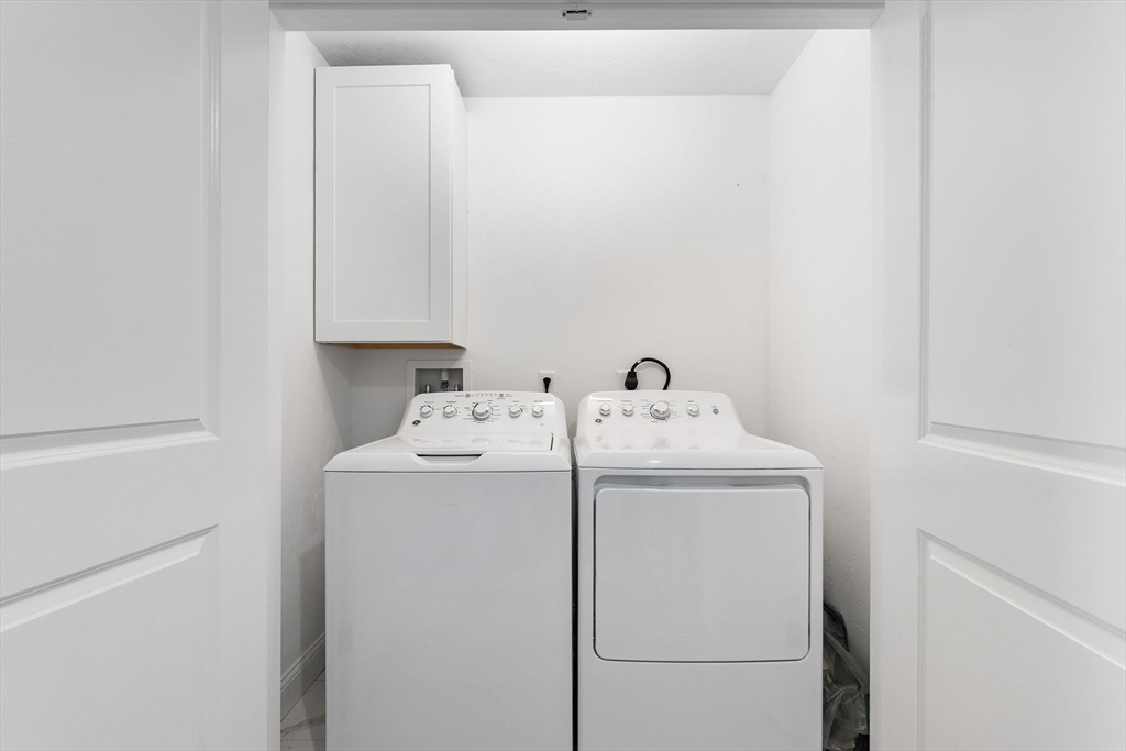 68 Prospect Street, Unit 14 Peabody, MA 01960 - Photo 14 of 29 a utility room with dryer and washer