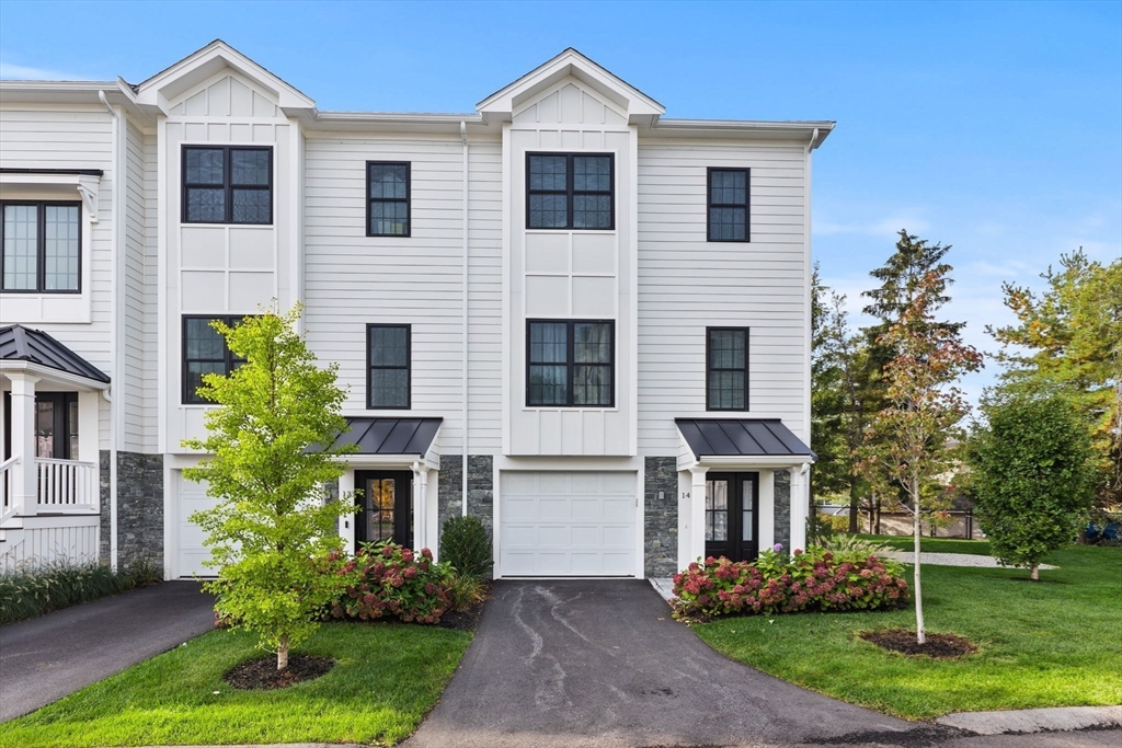 68 Prospect Street, Unit 14 Peabody, MA 01960 - Photo 4 of 29 a front view of house with yard and green space
