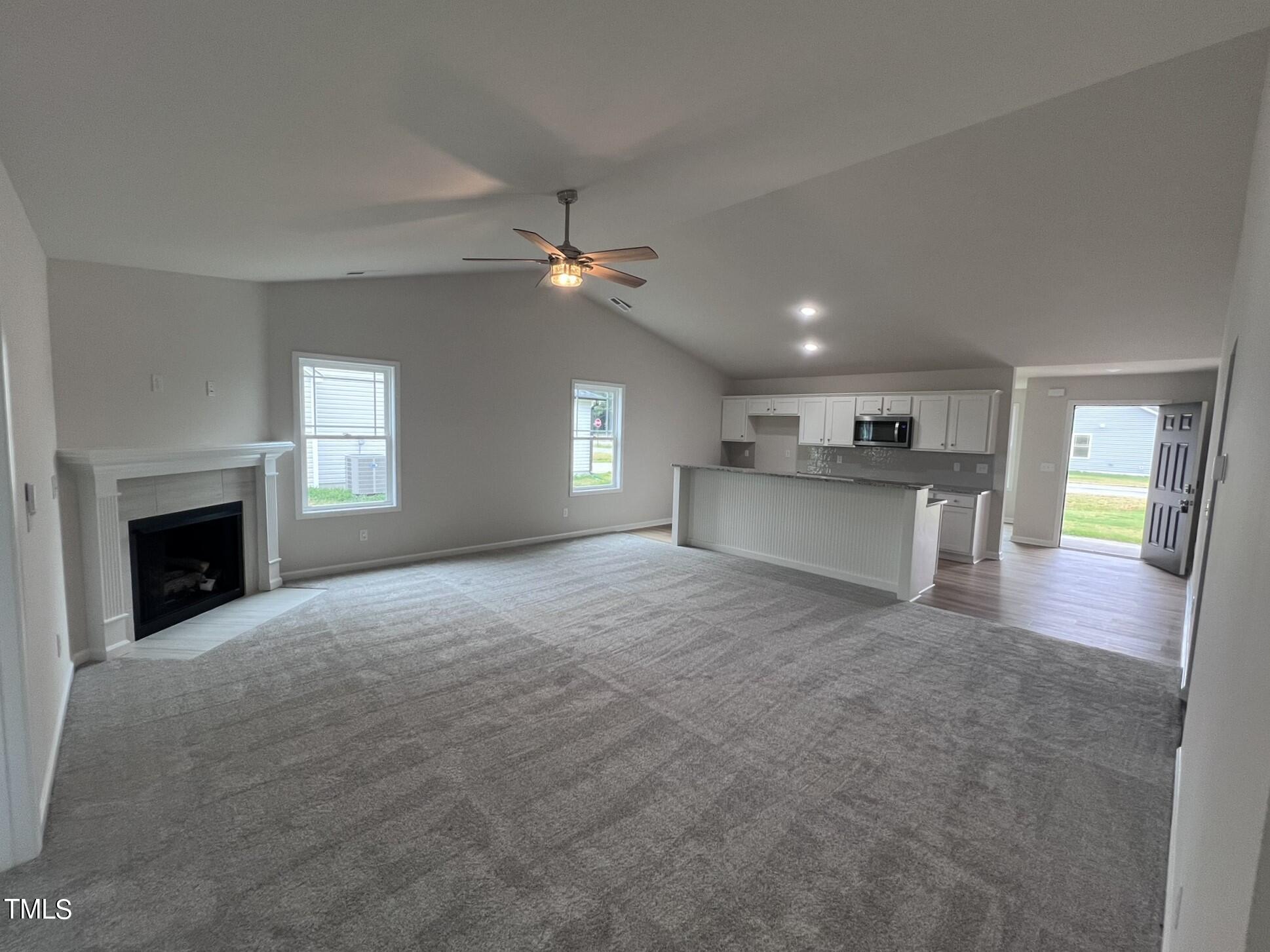 32 Scotties Ridge Drive Princeton, NC 27569 - Photo 11 of 24 a view of a big room with windows and fireplace
