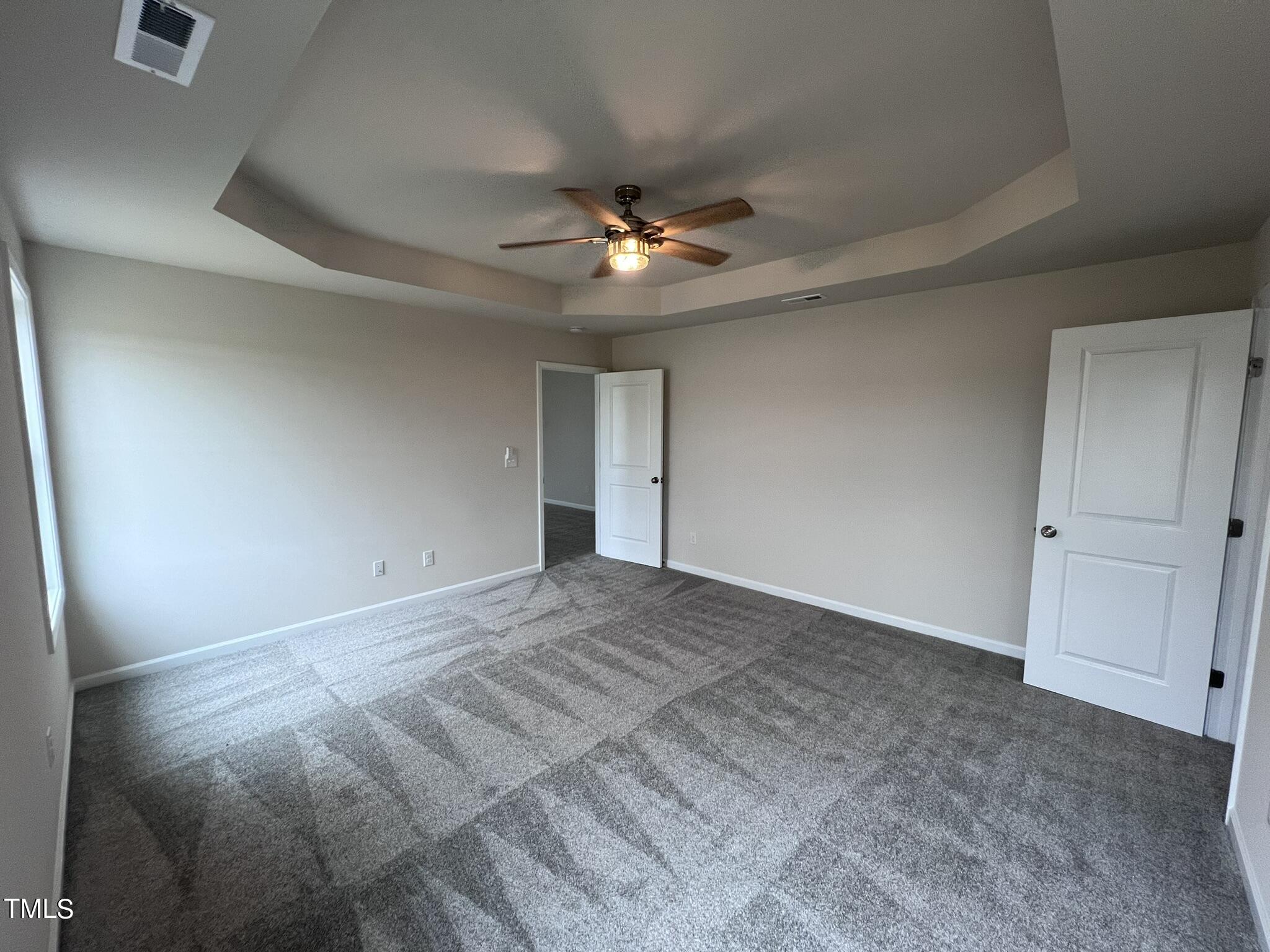 32 Scotties Ridge Drive Princeton, NC 27569 - Photo 14 of 24 an empty room with closet and a ceiling fan