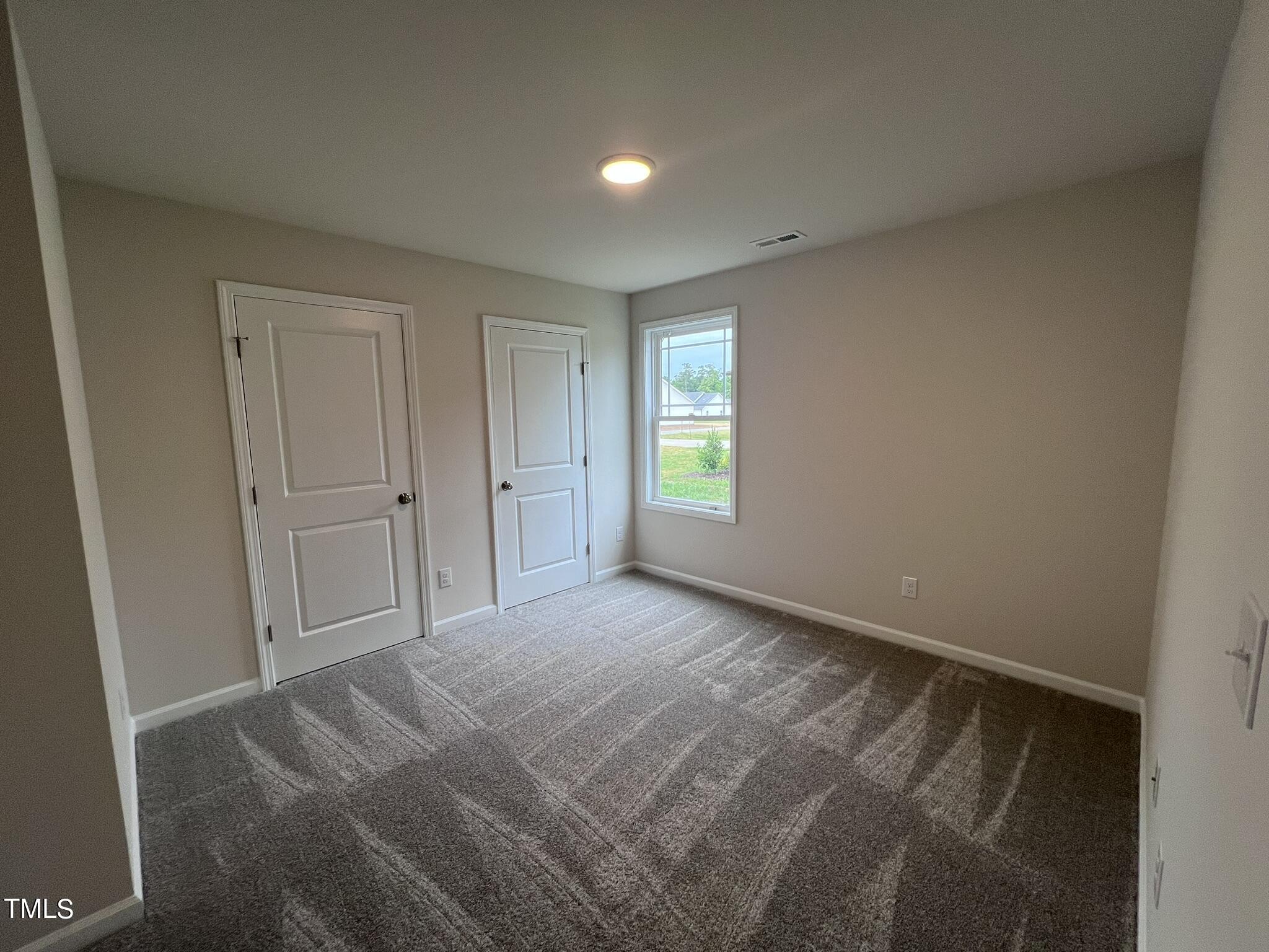 32 Scotties Ridge Drive Princeton, NC 27569 - Photo 20 of 24 a view of an empty room and window
