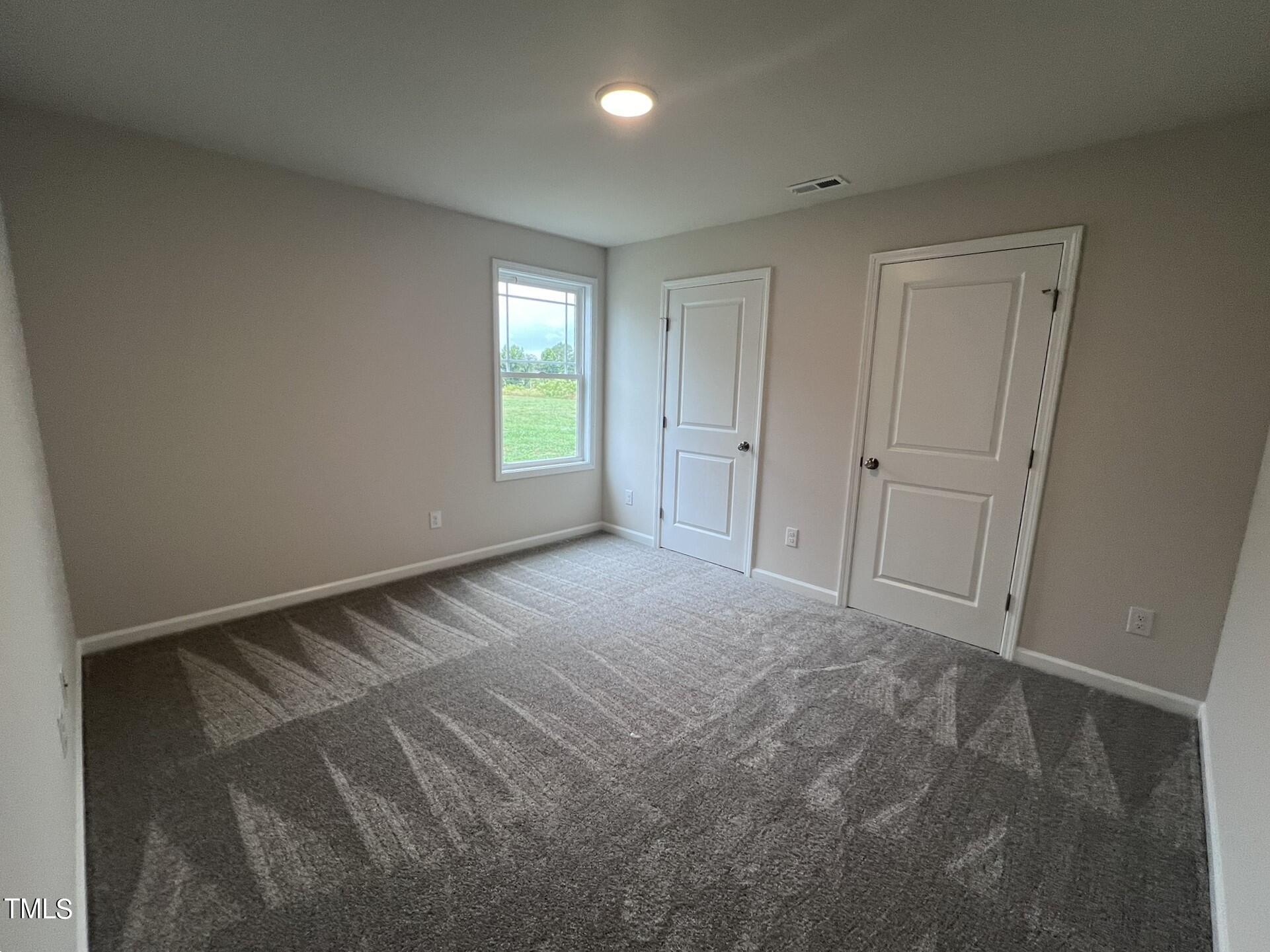 32 Scotties Ridge Drive Princeton, NC 27569 - Photo 21 of 24 a view of an empty room and window