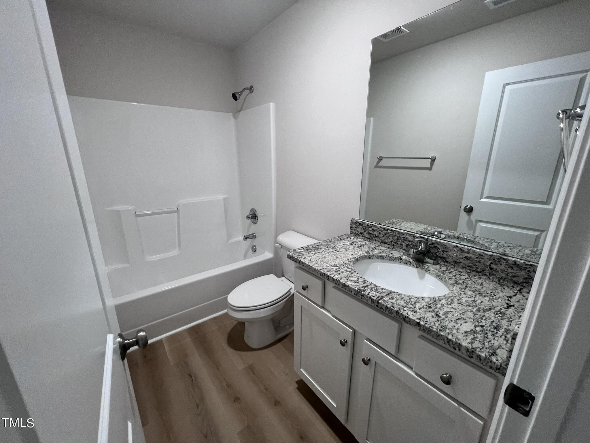 32 Scotties Ridge Drive Princeton, NC 27569 - Photo 22 of 24 a bathroom with a granite countertop sink toilet and shower