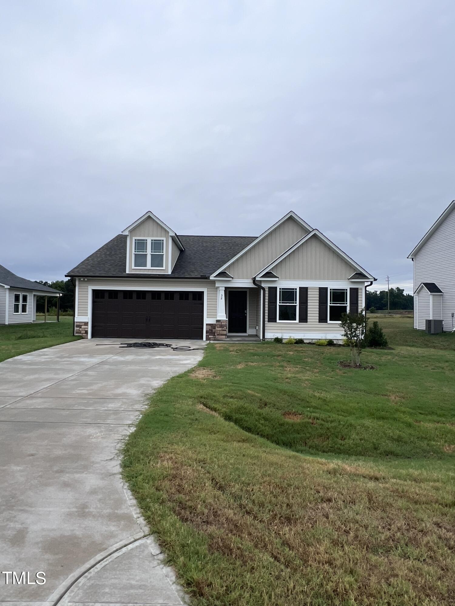 32 Scotties Ridge Drive Princeton, NC 27569 - Photo 3 of 24 a front view of a house with a yard