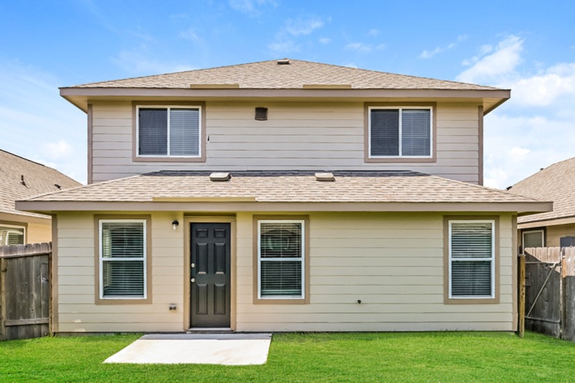 25751 Hazy Elm Lane Porter, TX 77365 - Photo 2 of 13 a view of a house with a yard