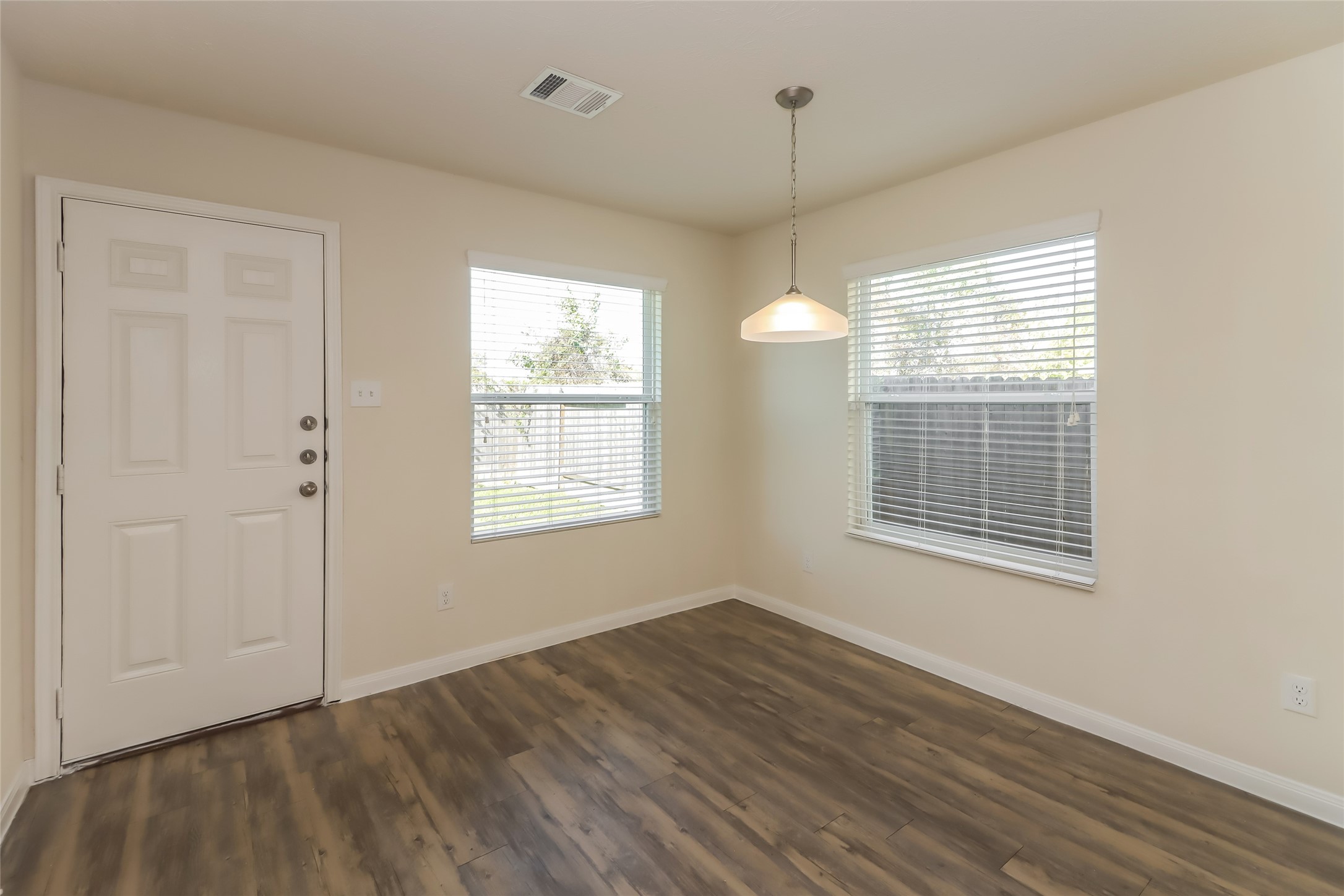 25751 Hazy Elm Lane Porter, TX 77365 - Photo 6 of 13 a view of an empty room with wooden floor and a window
